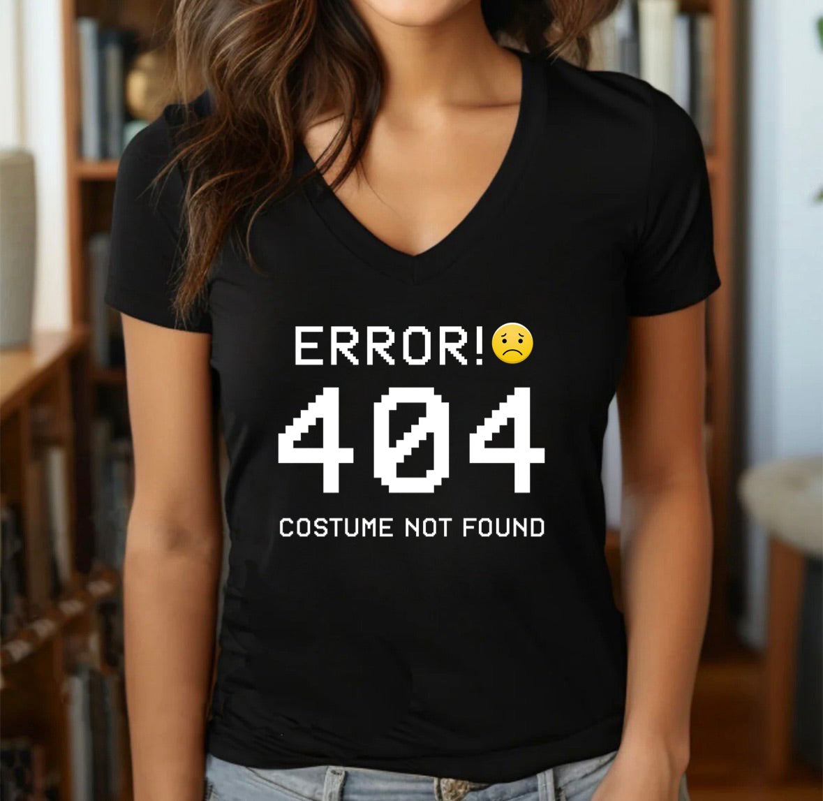 Black women’s V-neck Halloween T-shirt with pixelated Error 404 Costume Not Found text and yellow sad emoji graphic.