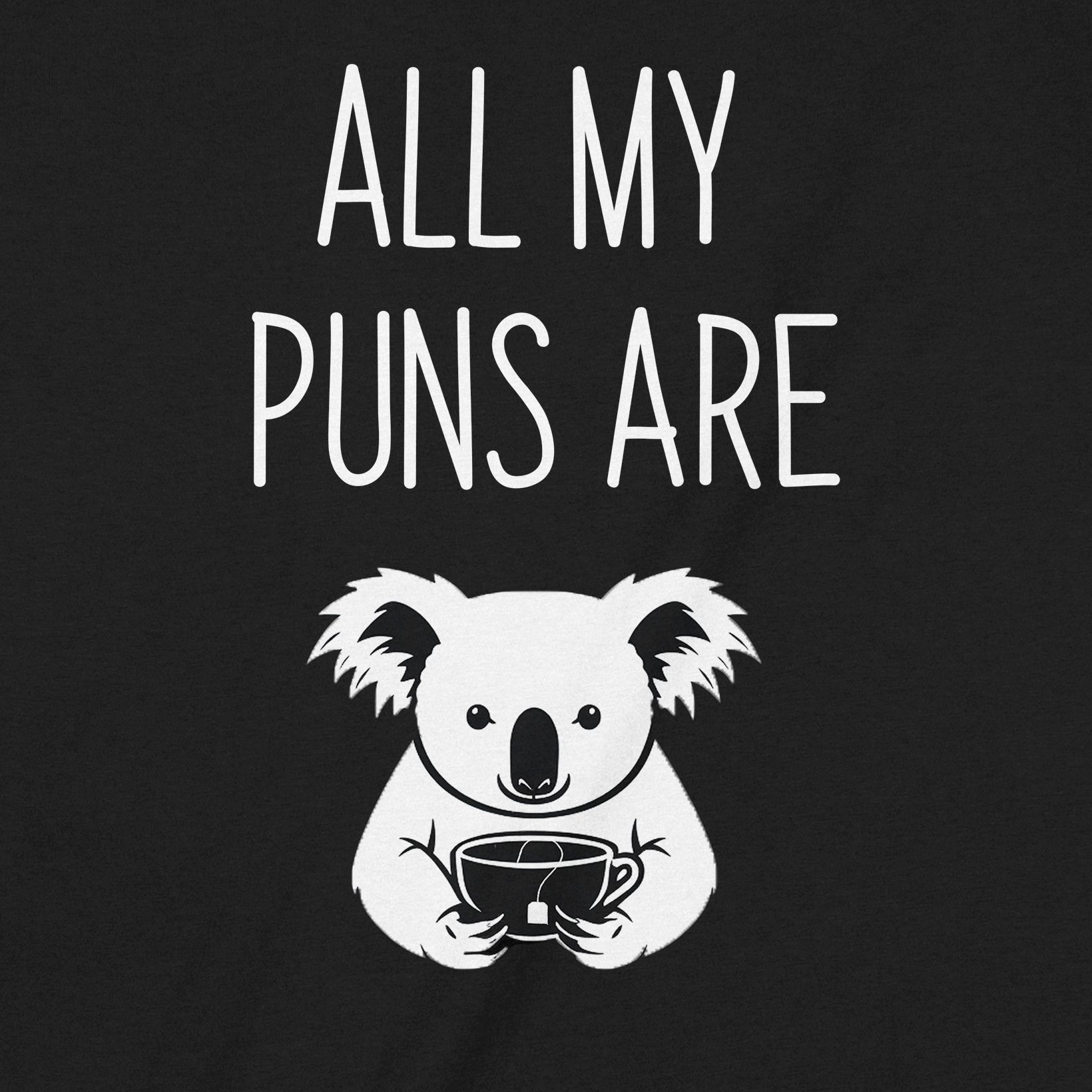 Closeup of all my puns are koala shirt showing koala illustration and playful pun text on black shirt
