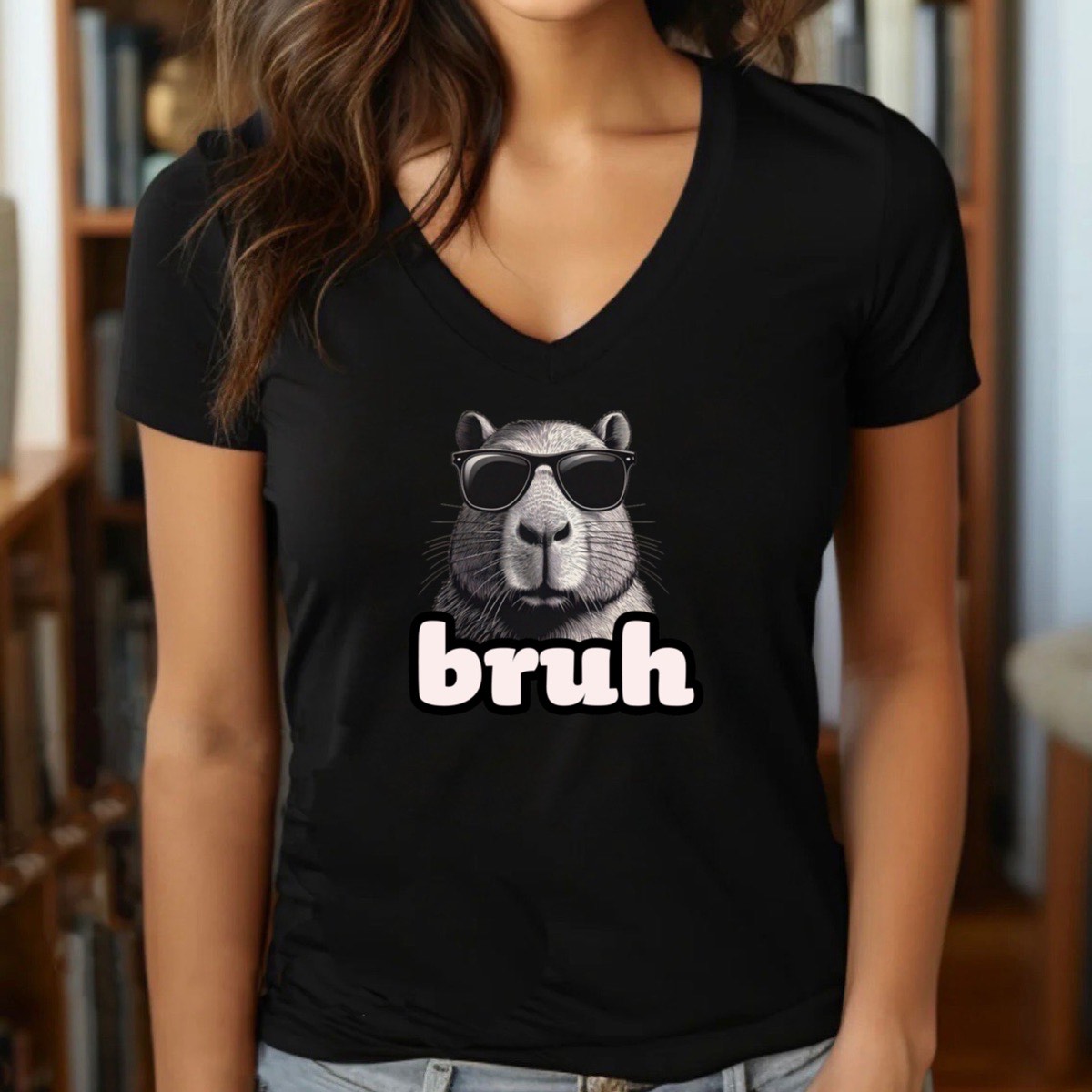 Woman wearing black v-neck bruh capybara meme t-shirt with sunglasses graphic, indoor lifestyle