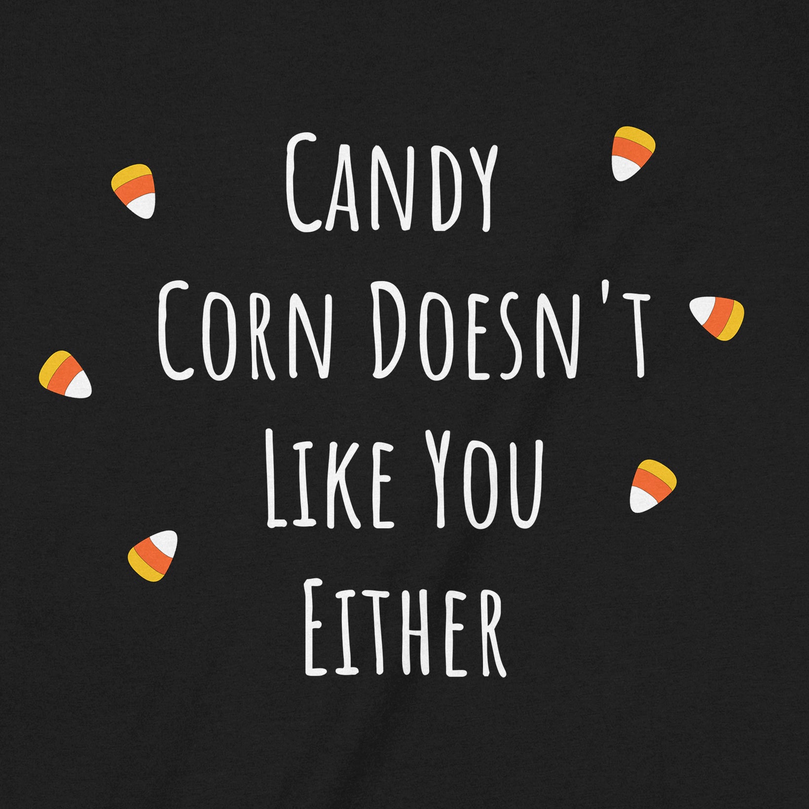 Closeup of black t-shirt design with candy corn accents and the phrase Candy Corn Doesn't Like You Either.