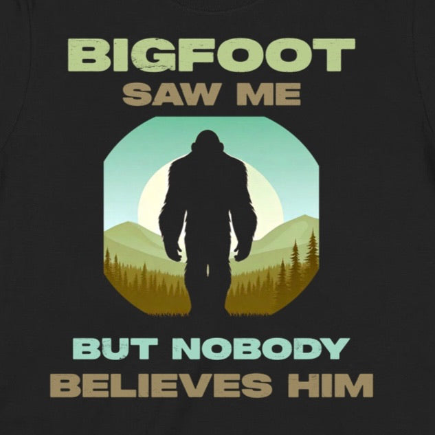 Closeup of Bigfoot saw me but nobody believes him shirt with bold retro lettering and mountain sunset background