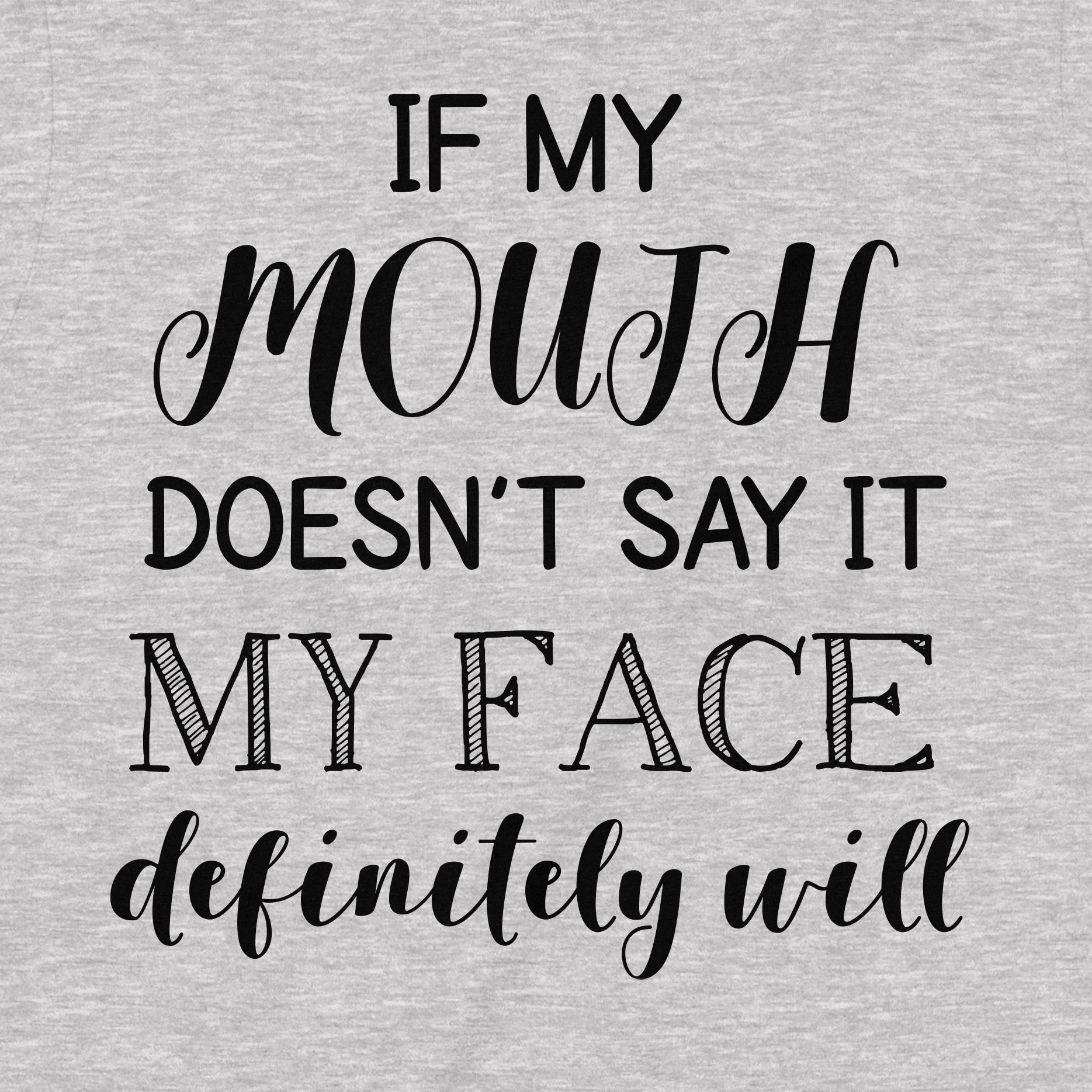 Close-up of shirt design with quote "If my mouth doesn’t say it my face definitely will" in stylish fonts.