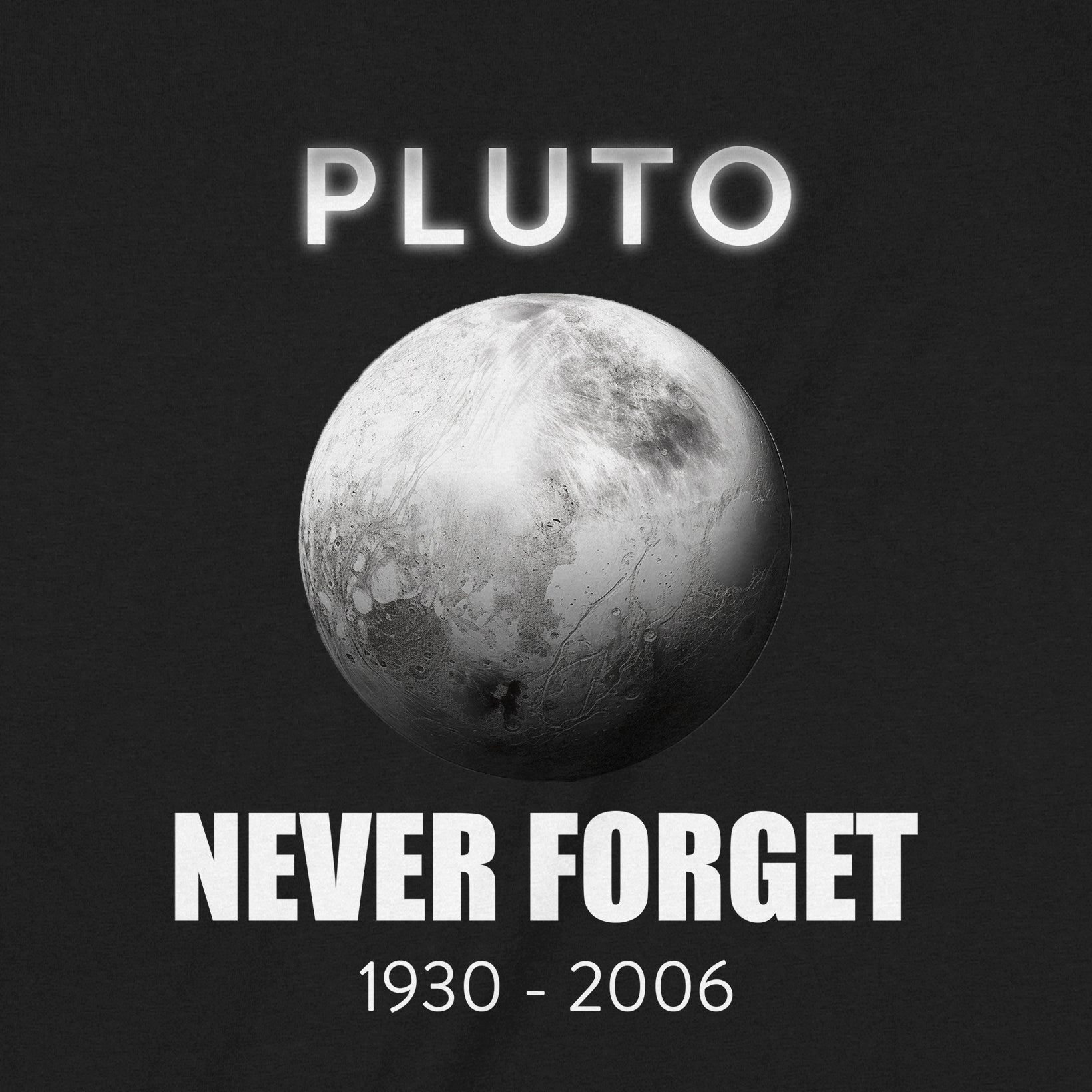 Close-up of Pluto design on black t-shirt with text “Pluto Never Forget 1930–2006.”