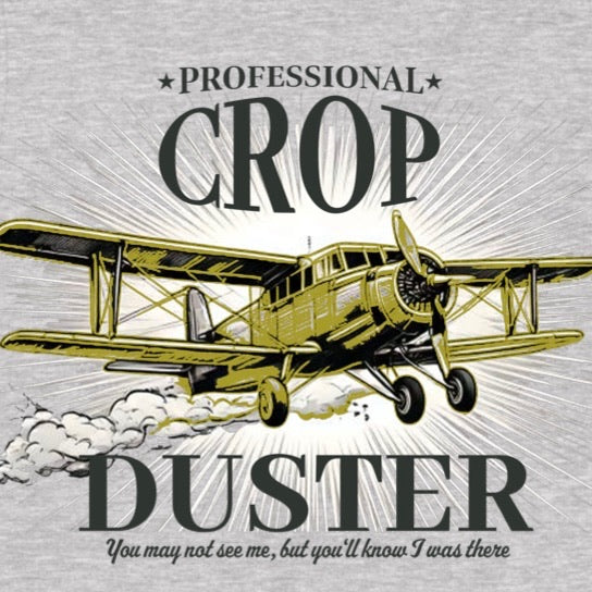 Closeup of yellow crop duster plane with bold text professional crop duster on grey shirt