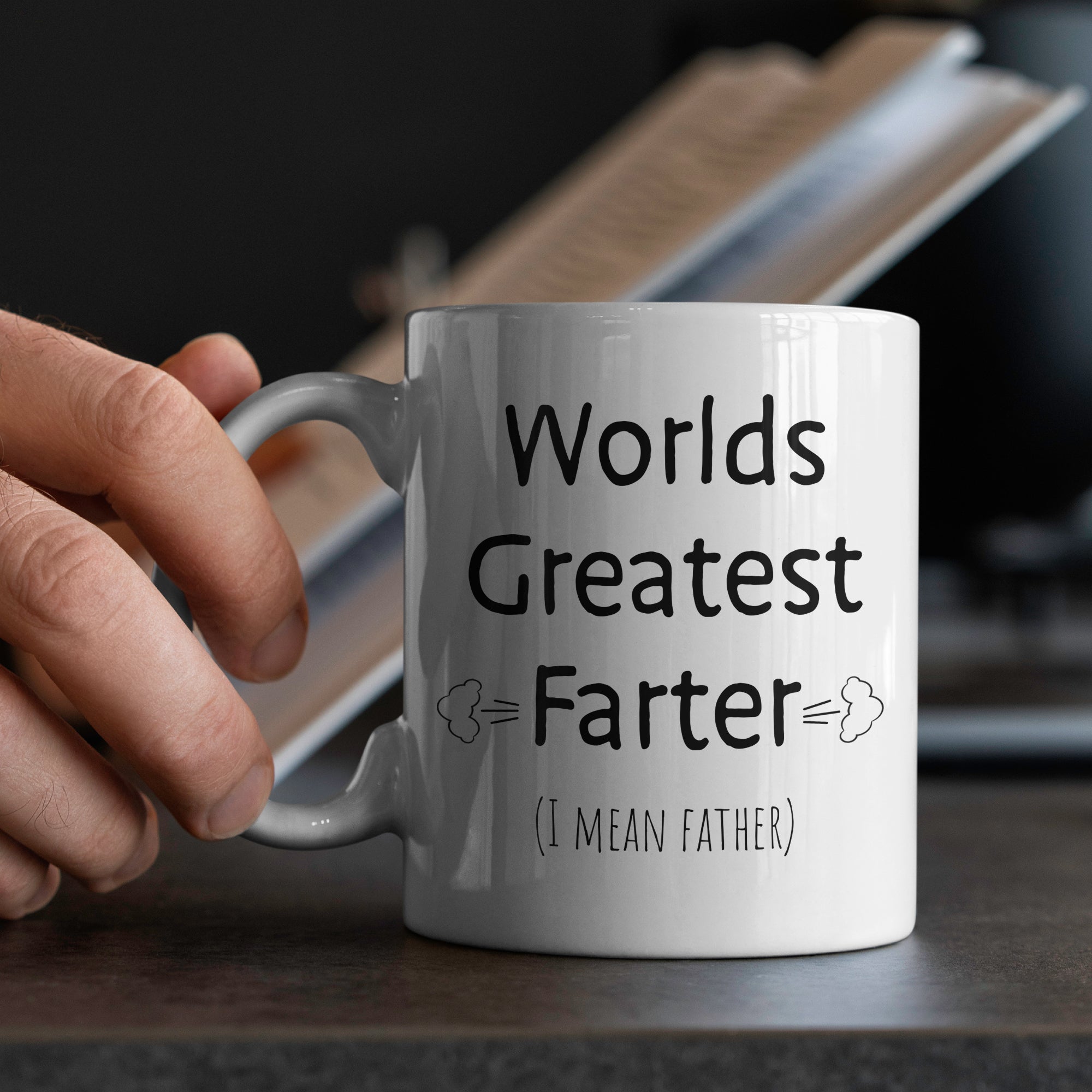 White ceramic dad mug in hands with worlds greatest farter design perfect fathers day gift