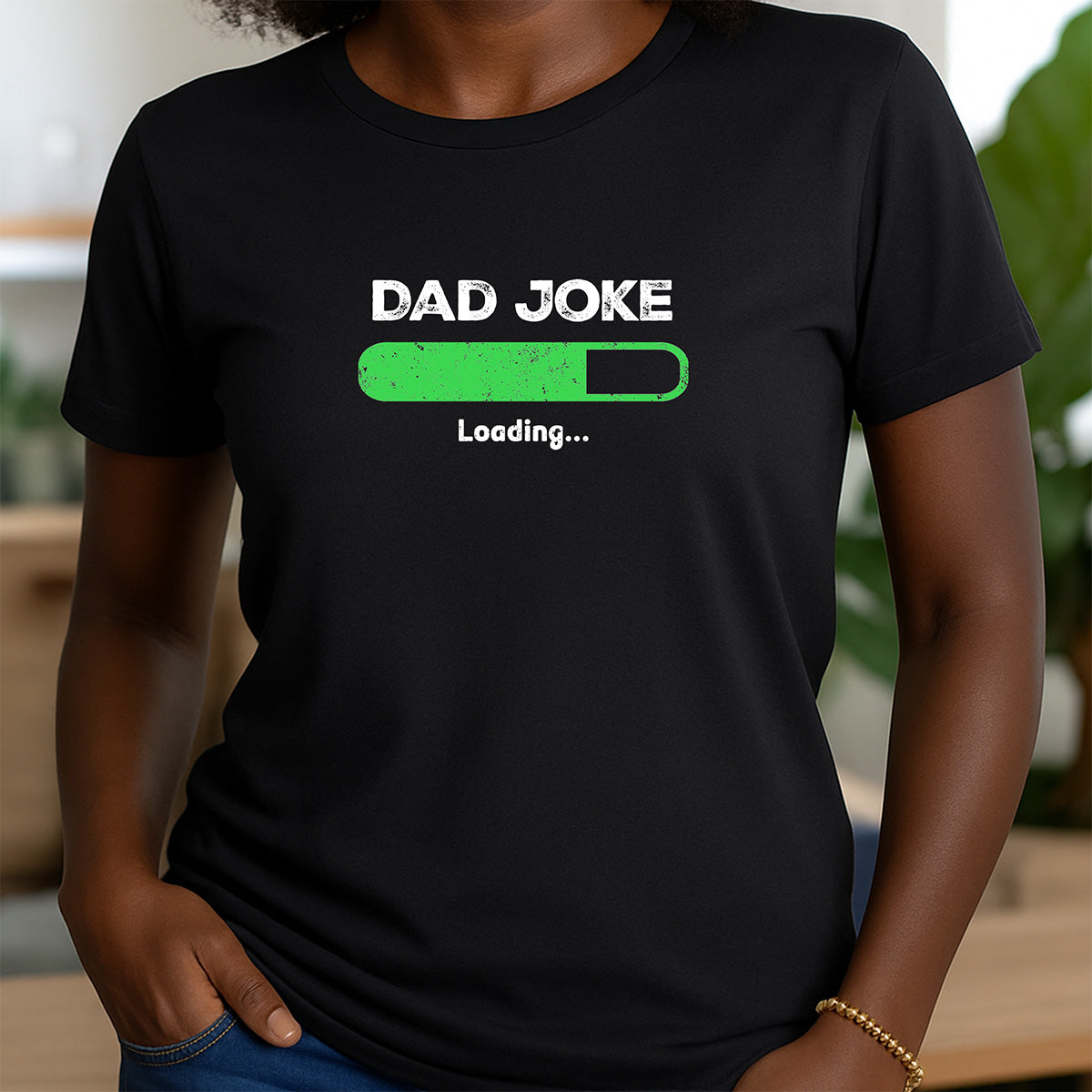 Woman in black crewneck t-shirt with white Dad Joke Loading text and green progress bar design