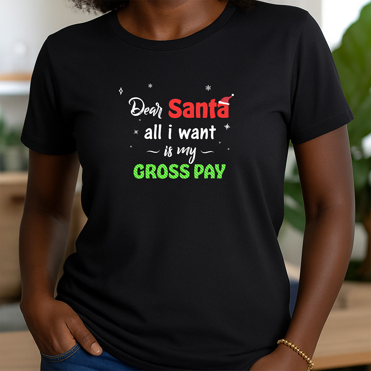 Woman in black crewneck Christmas t-shirt with Dear Santa all I want is my gross pay festive lettering