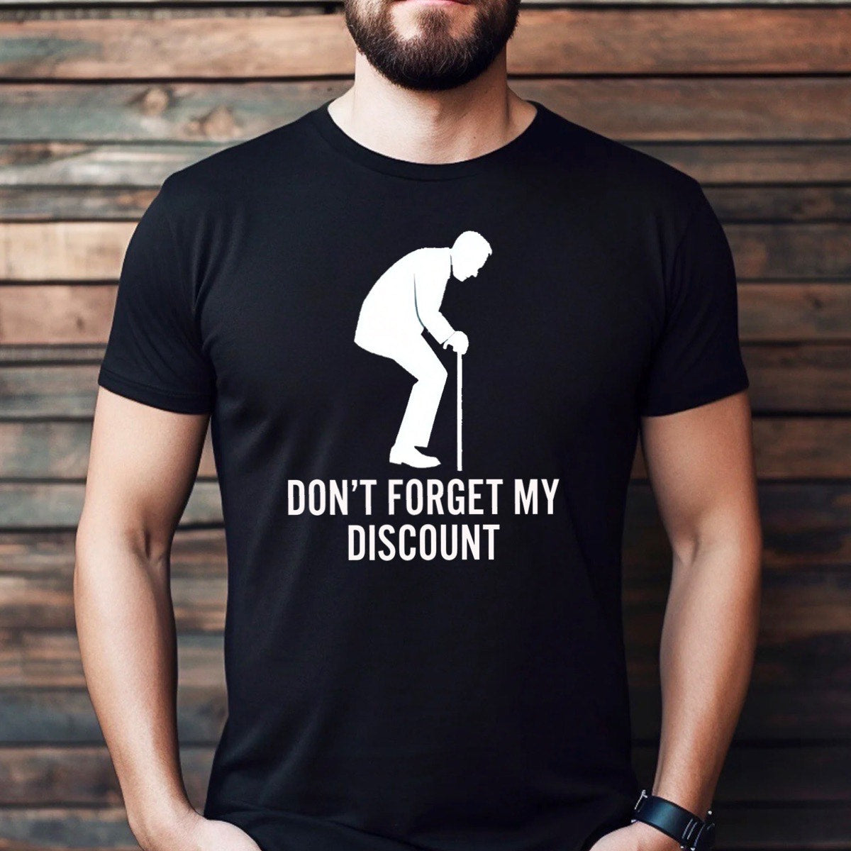 Man wearing black t-shirt featuring white senior silhouette and Don’t forget my discount text, casual lifestyle