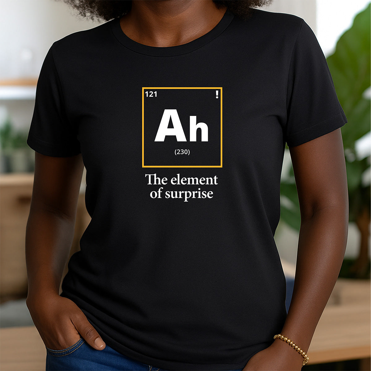 Woman in black crew neck t-shirt with Ah periodic element design and text the element of surprise