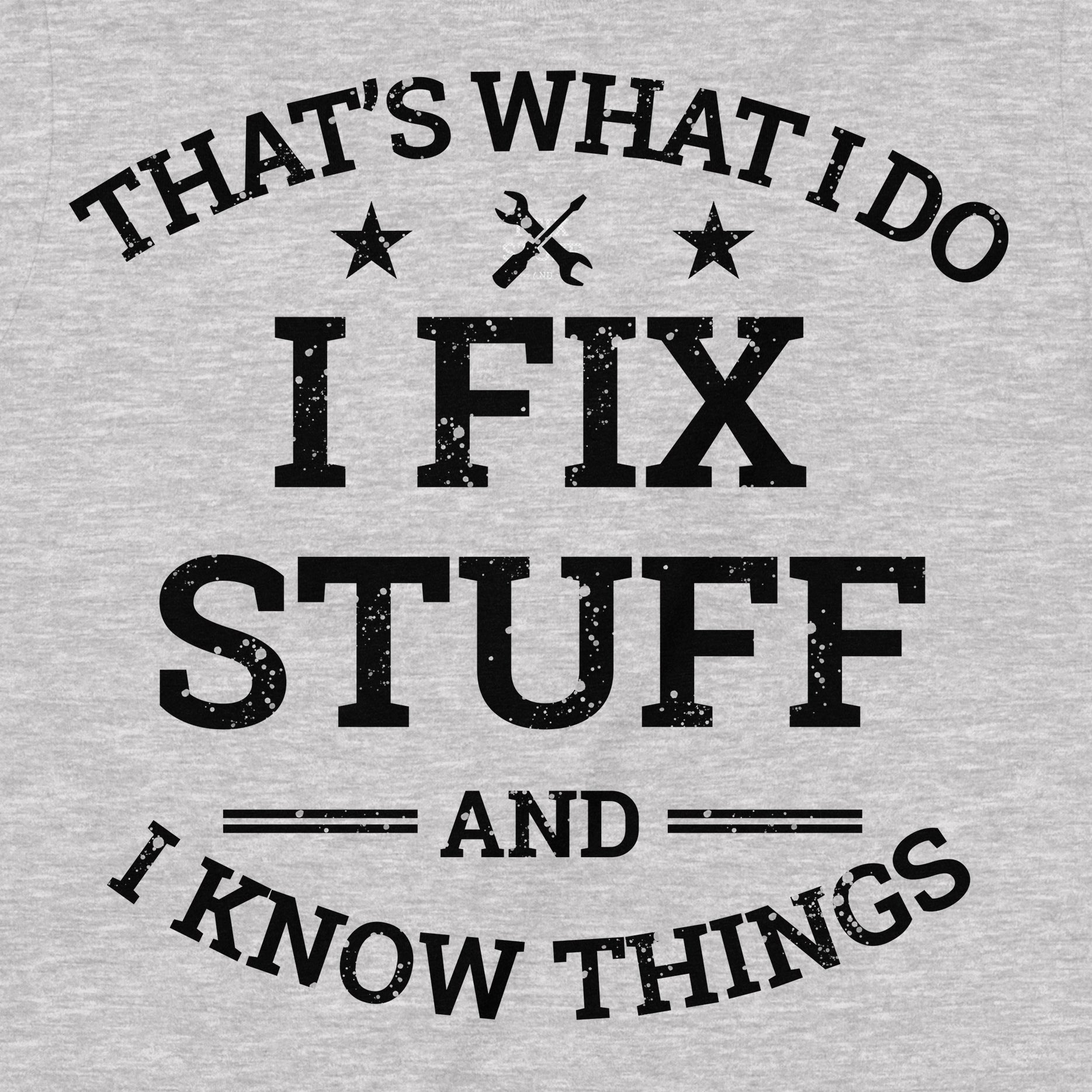 Close-up of black distressed text I Fix Stuff And I Know Things on grey t-shirt with tool icons