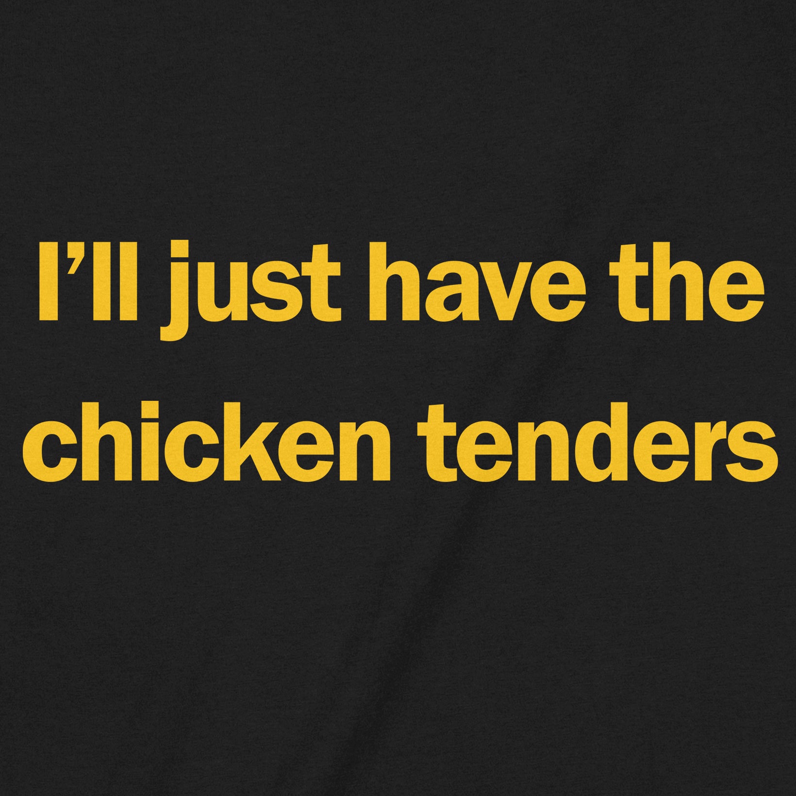 Close-up of the text I’ll just have the chicken tenders on a black shirt in yellow font