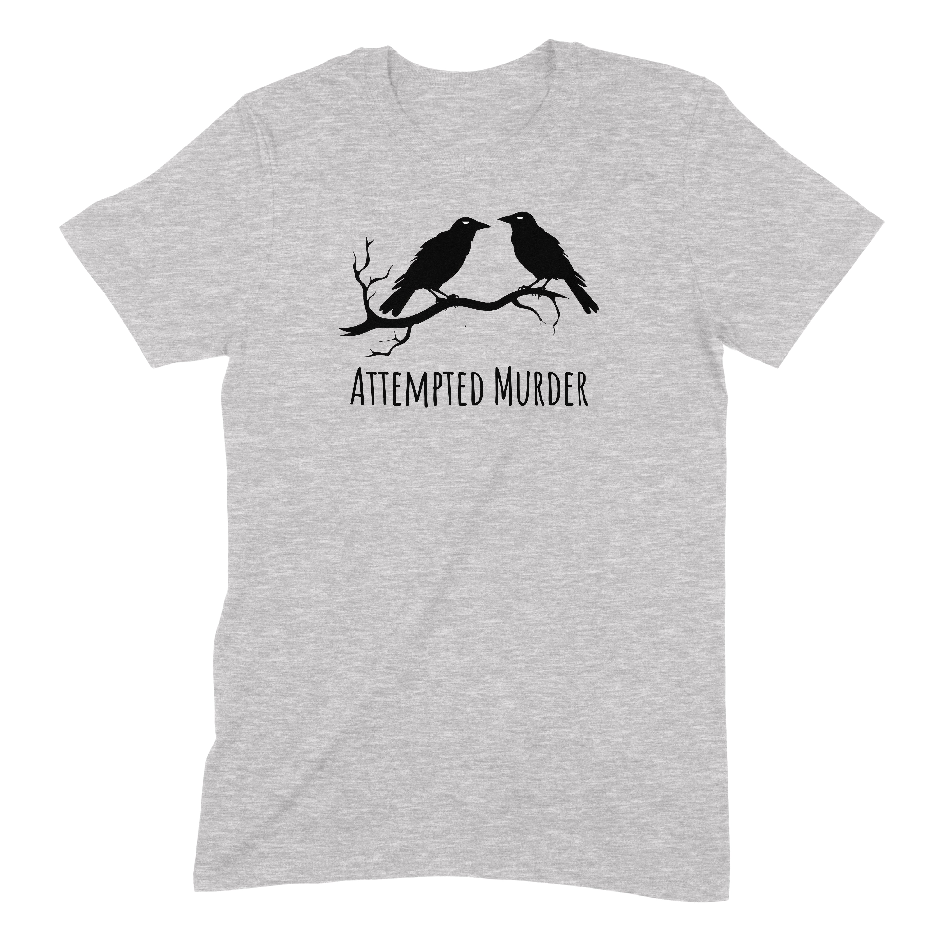 Flat-lay gray t-shirt with two crows on a branch and Attempted Murder text, witty pun shirt for bird lovers and humor fans