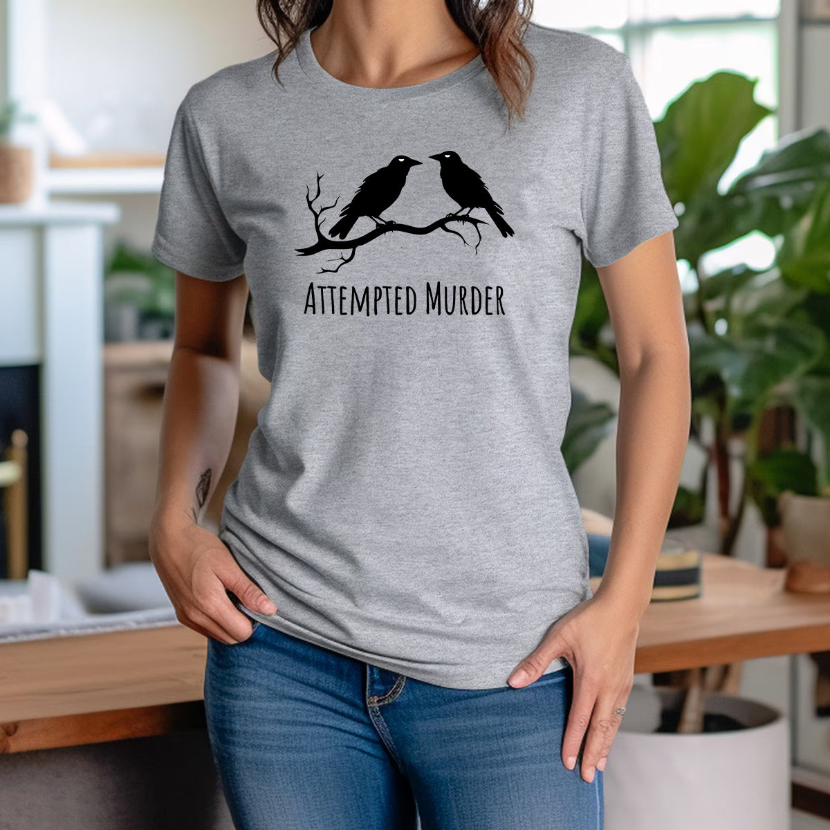 Women’s gray crewneck shirt with two crow graphic and Attempted Murder phrase, playful pun tee for casual everyday wear