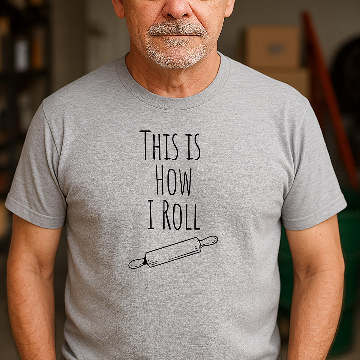 Men’s gray crewneck tee featuring This Is How I Roll text with rolling pin design, funny shirt gift for bakers and cooks