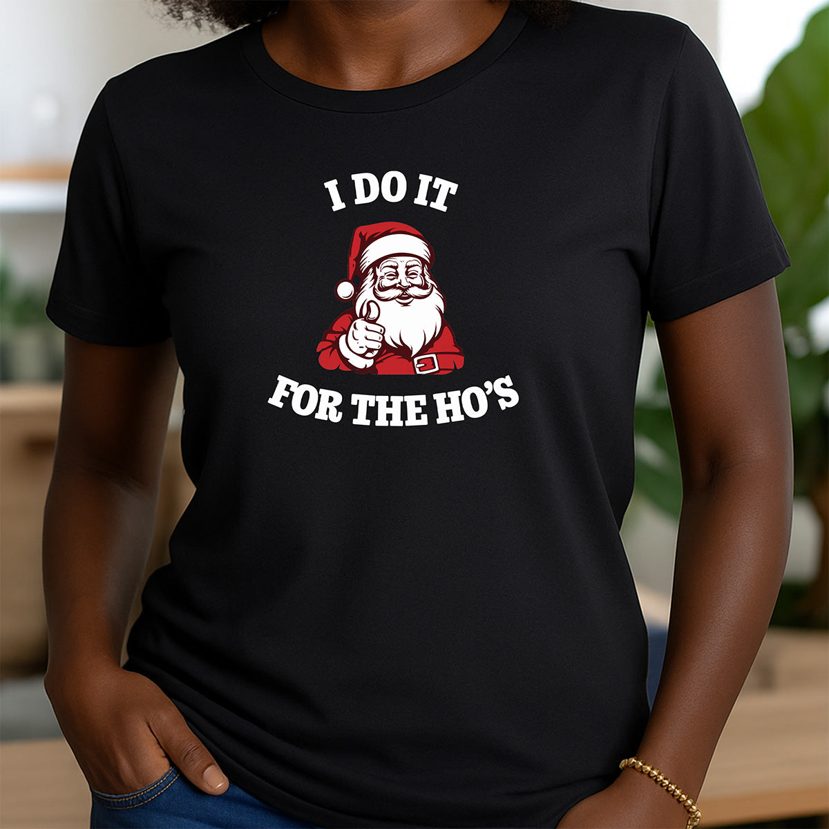 Black crew neck t-shirt with funny Christmas design featuring Santa and the phrase I do it for the Ho's