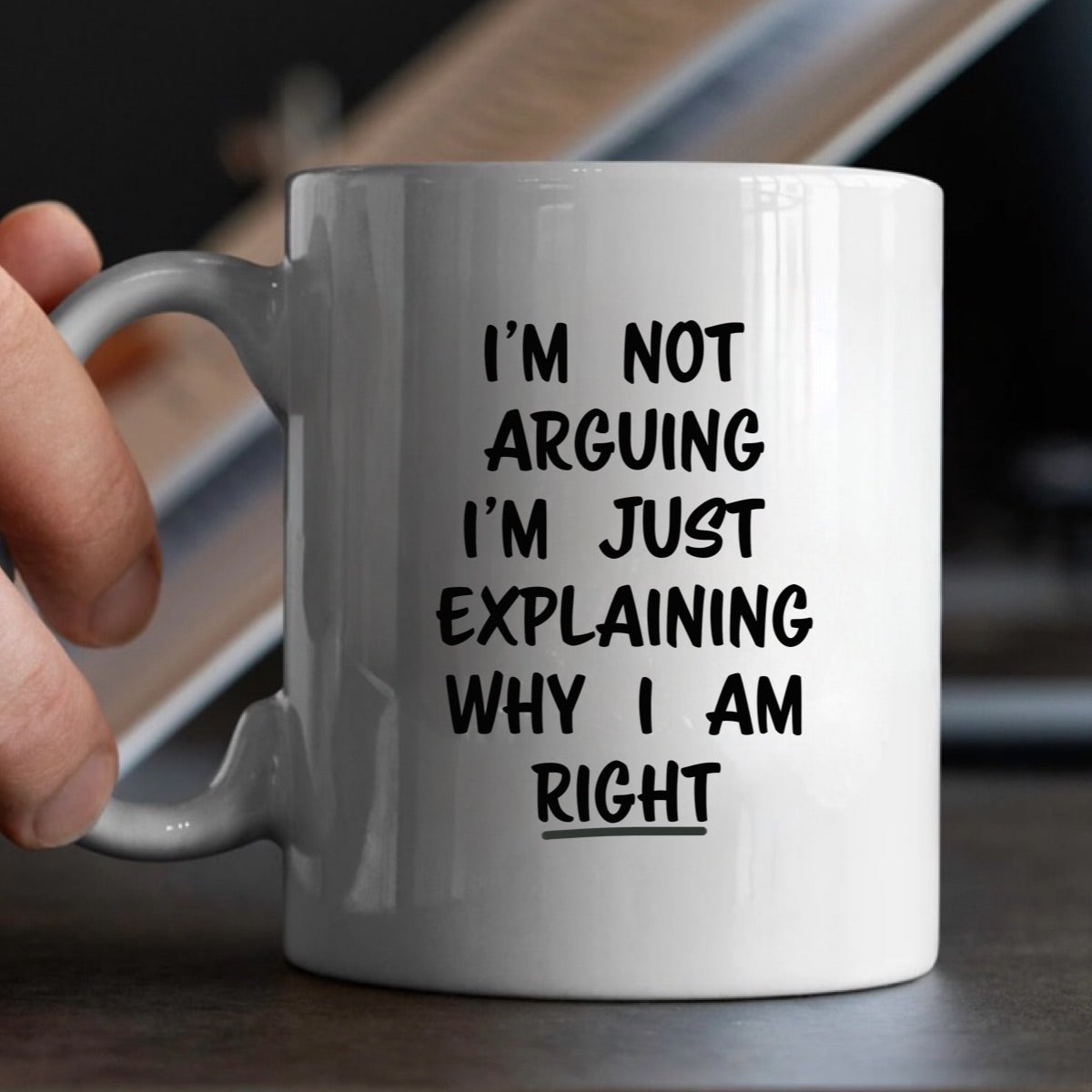 White ceramic mug in hands with im not arguing im just explaining why i am right design perfect gift