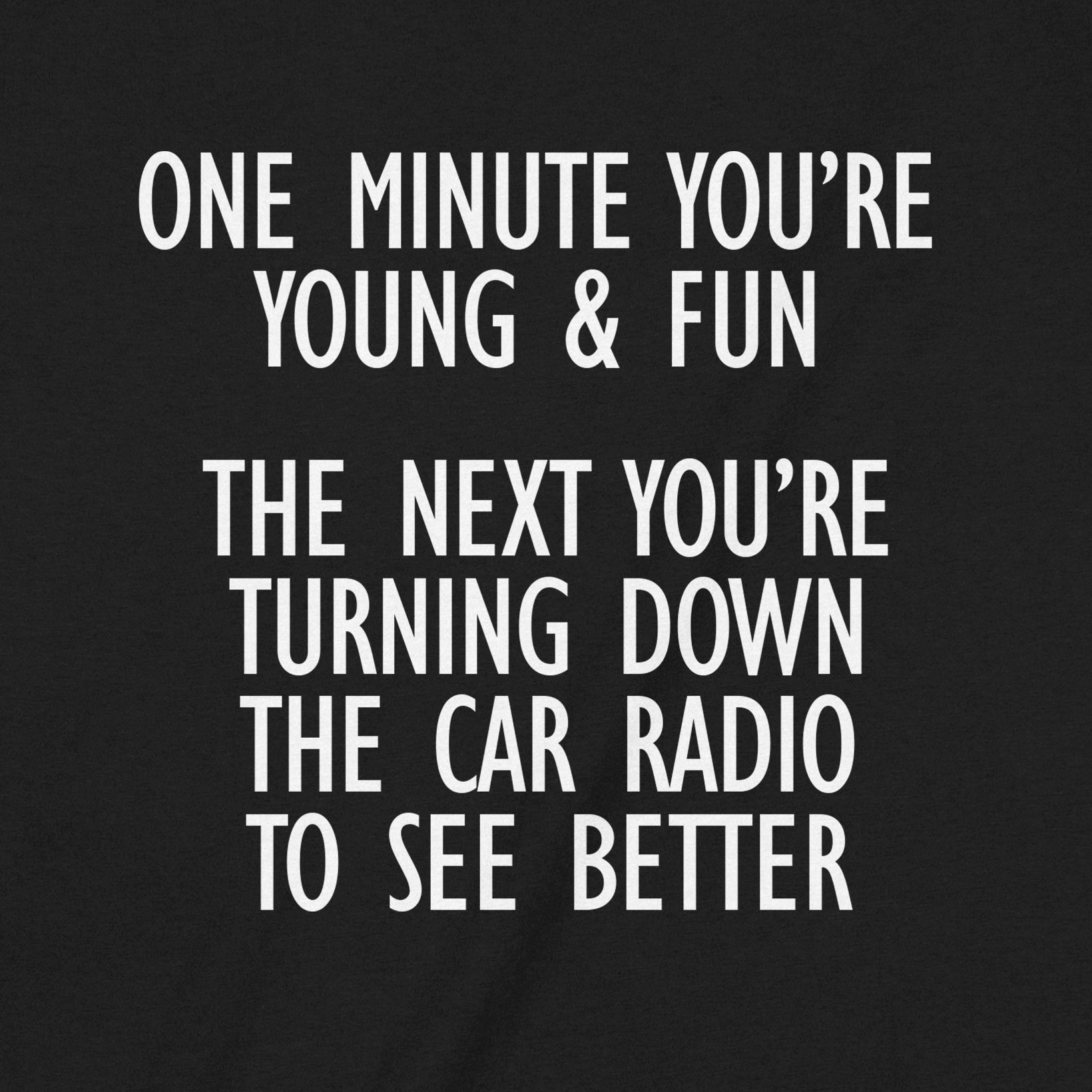 Closeup black t-shirt with humorous quote about aging and turning down car radio to see better