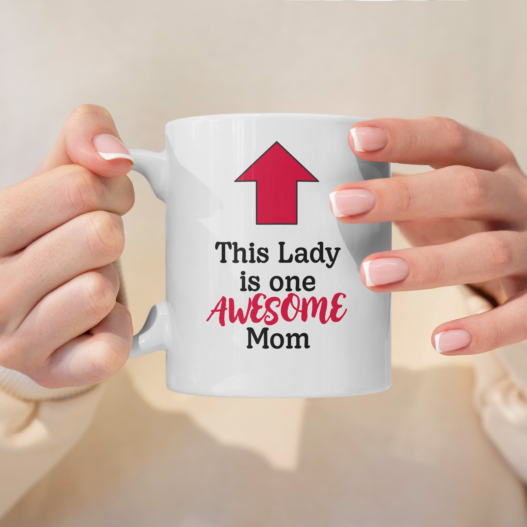 This Lady Is One Awesome Mom white mug held in two hands