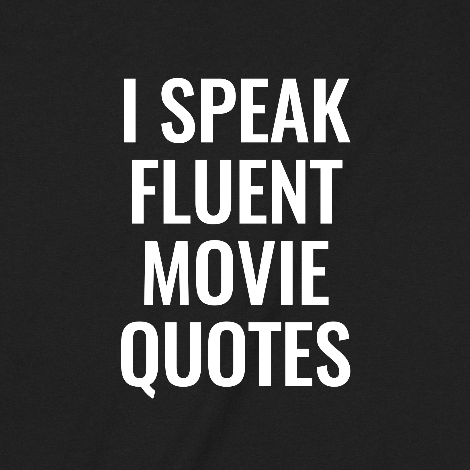 Closeup view of black t-shirt with bold white text I Speak Fluent Movie Quotes