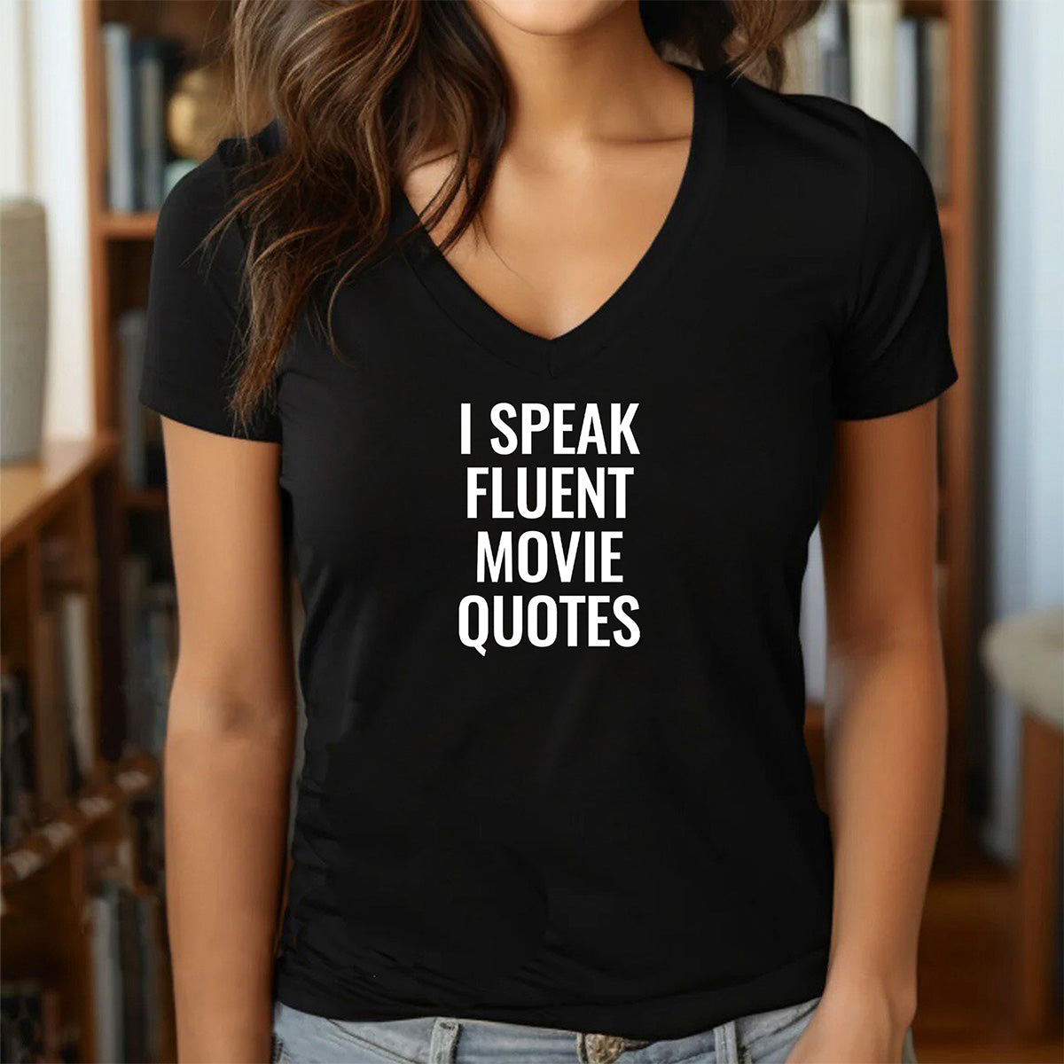 Women’s black v-neck t-shirt with bold white text I Speak Fluent Movie Quotes