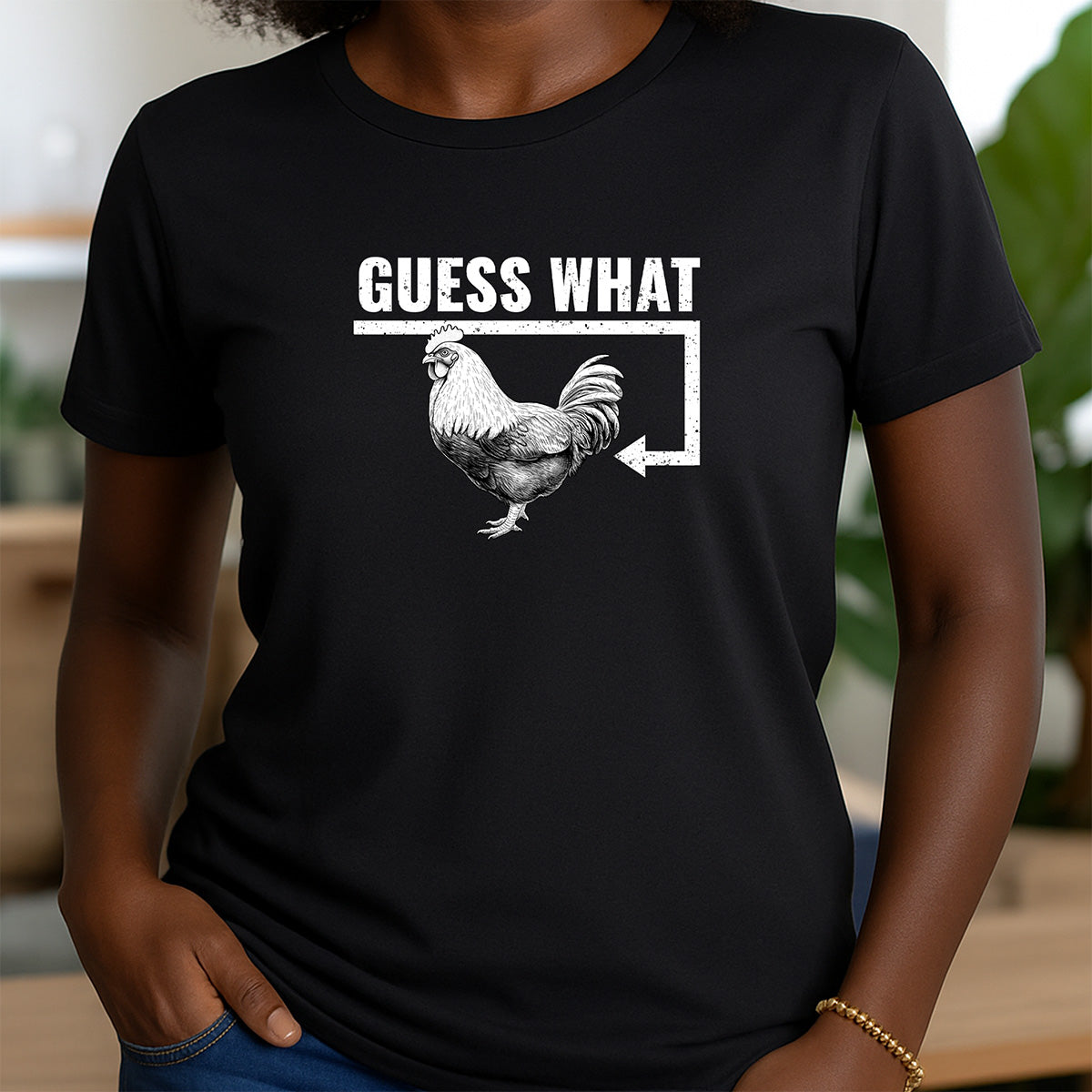 Women’s crewneck t-shirt in black with rooster graphic and Guess What design for casual wear