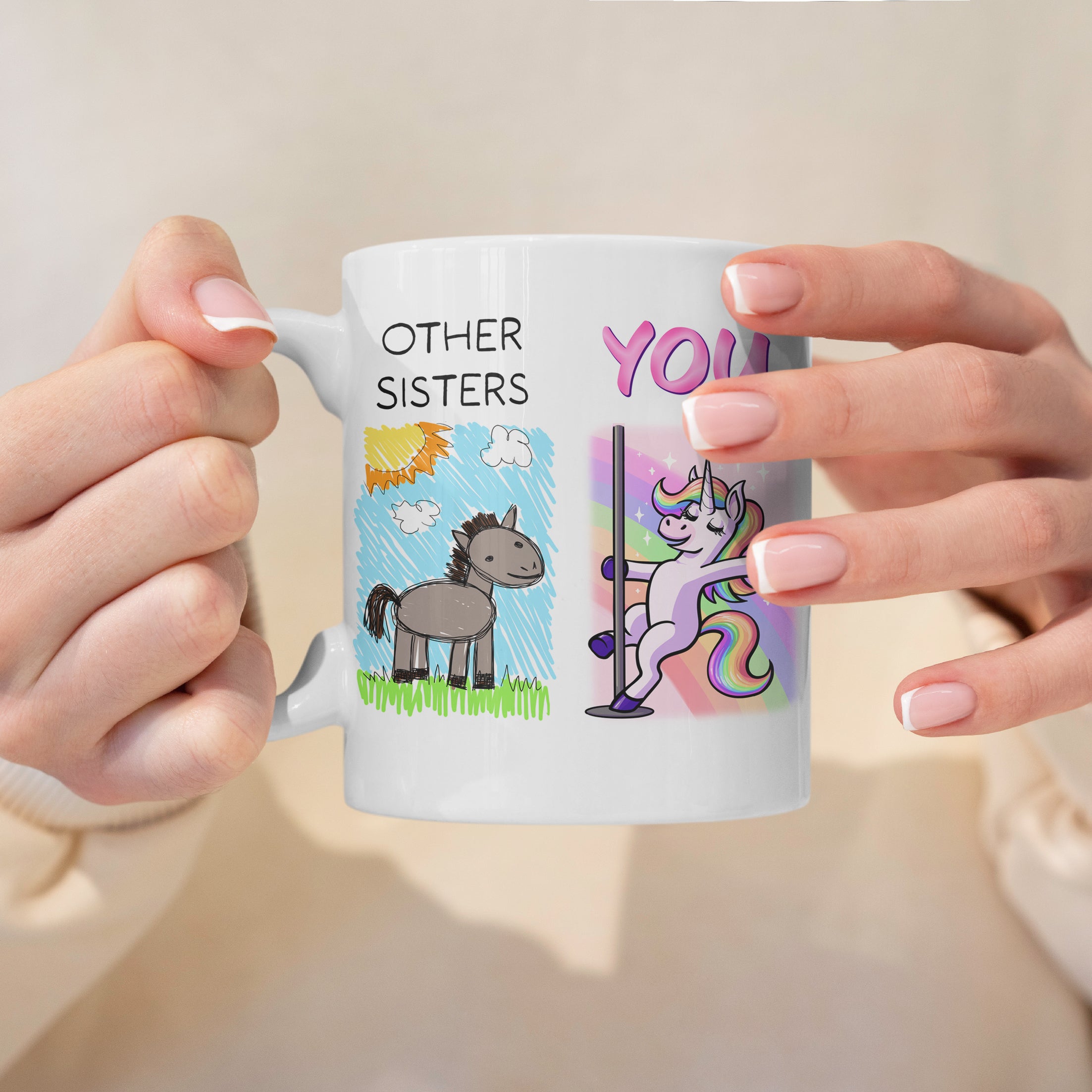 Person holding a mug with cartoon designs and text on a light background