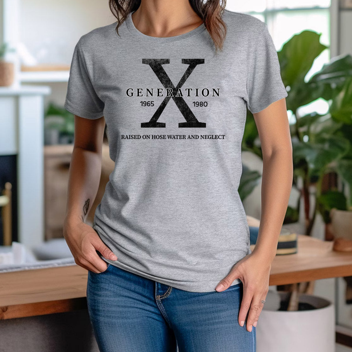Woman wearing grey Generation X graphic t-shirt with bold X and nostalgic quote "Raised on hose water and neglect".