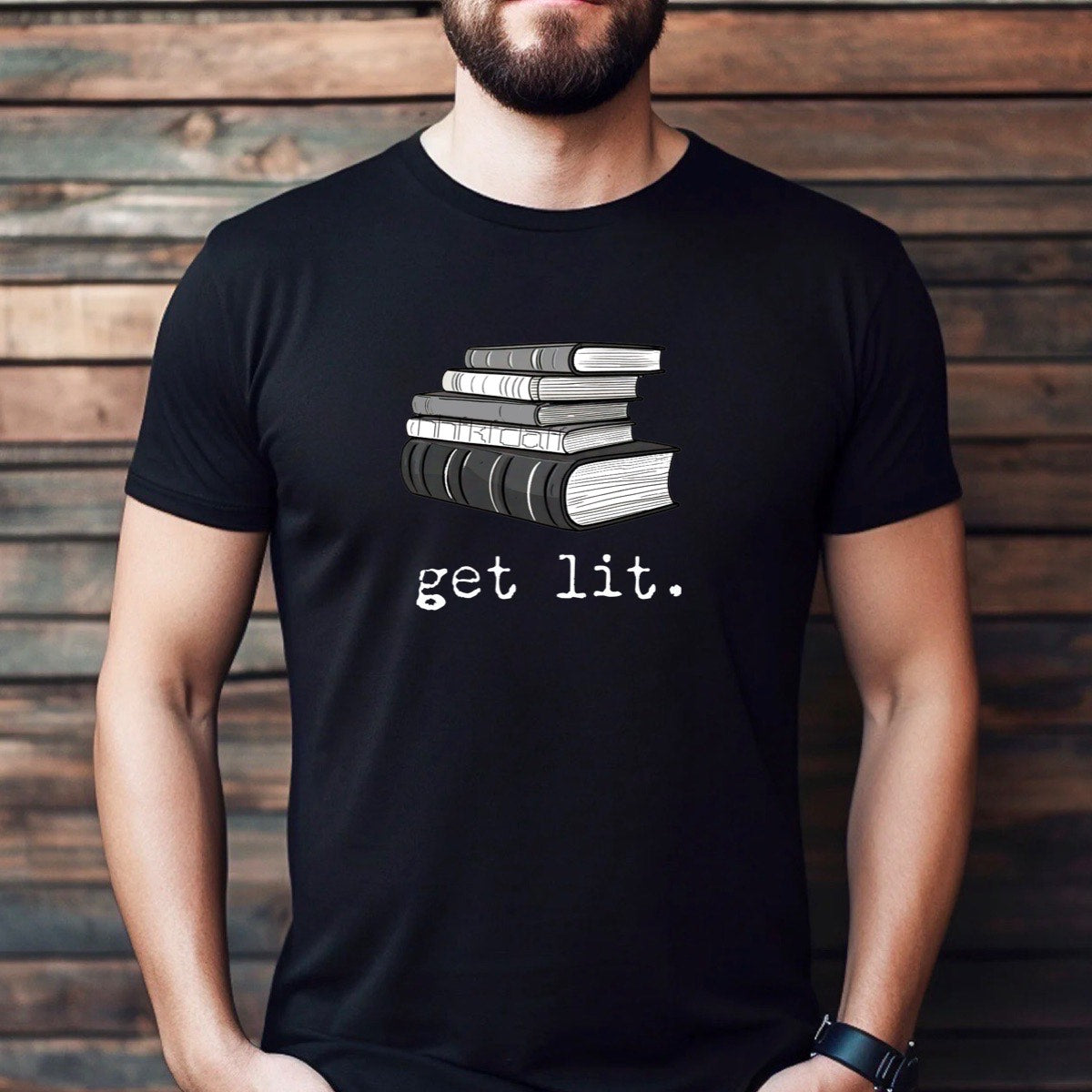 Man wearing black t-shirt with stacked books and get lit text, book lover literature pun, casual lifestyle