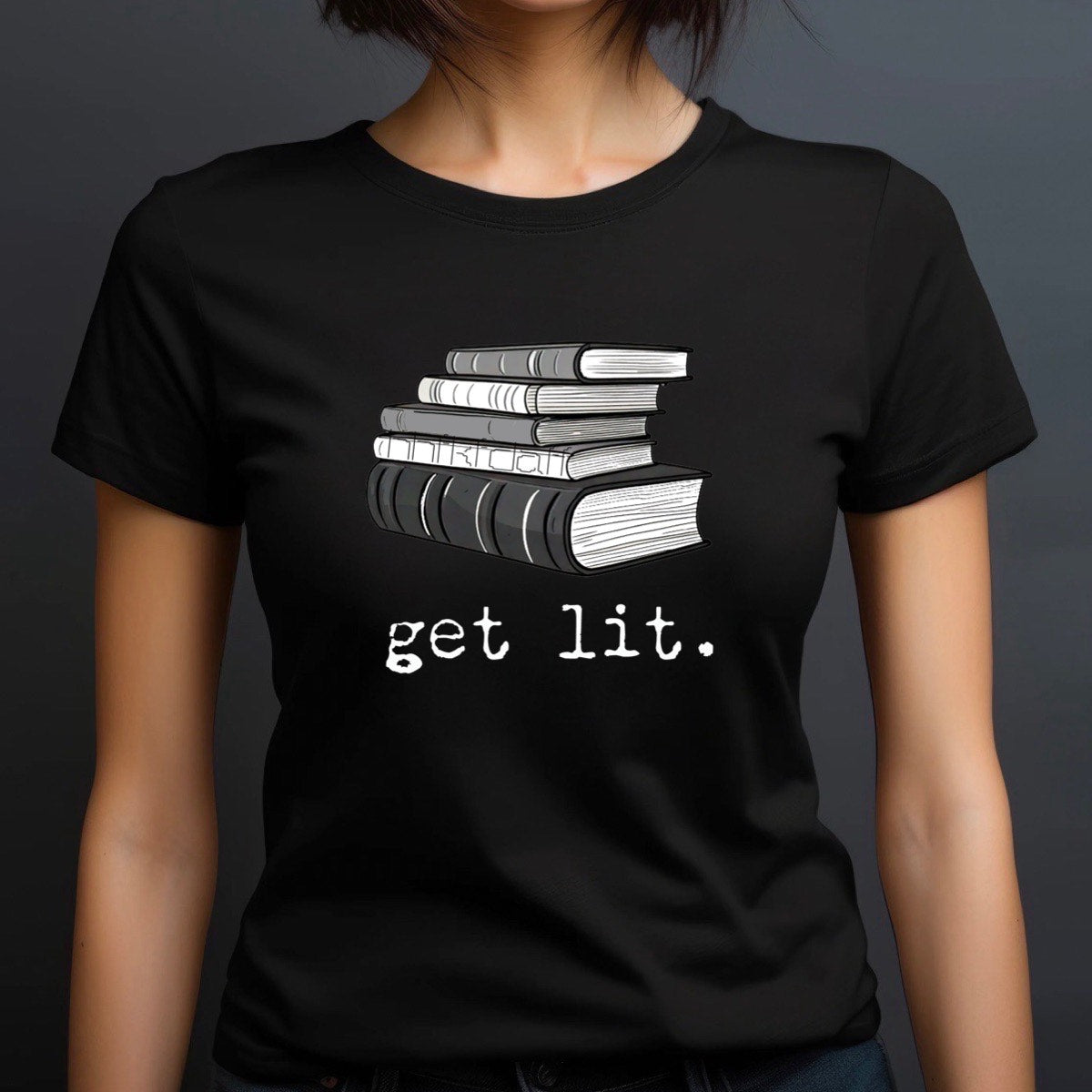 Woman wearing black crewneck t-shirt with stacked books graphic and get lit text, reader gift