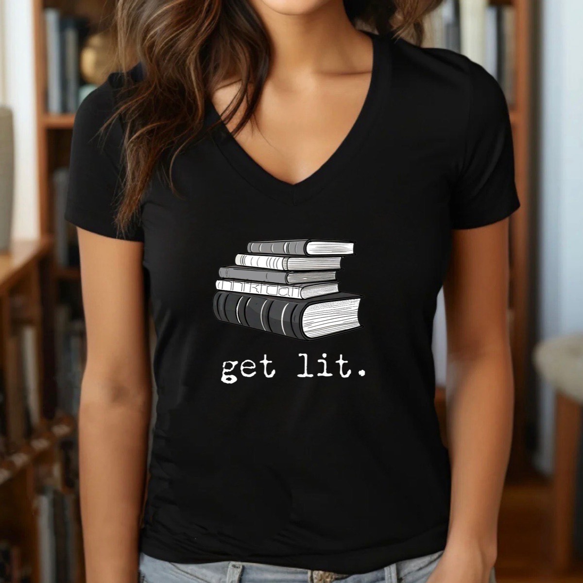 Woman wearing black v-neck t-shirt with stacked books and get lit text, literature pun shirt