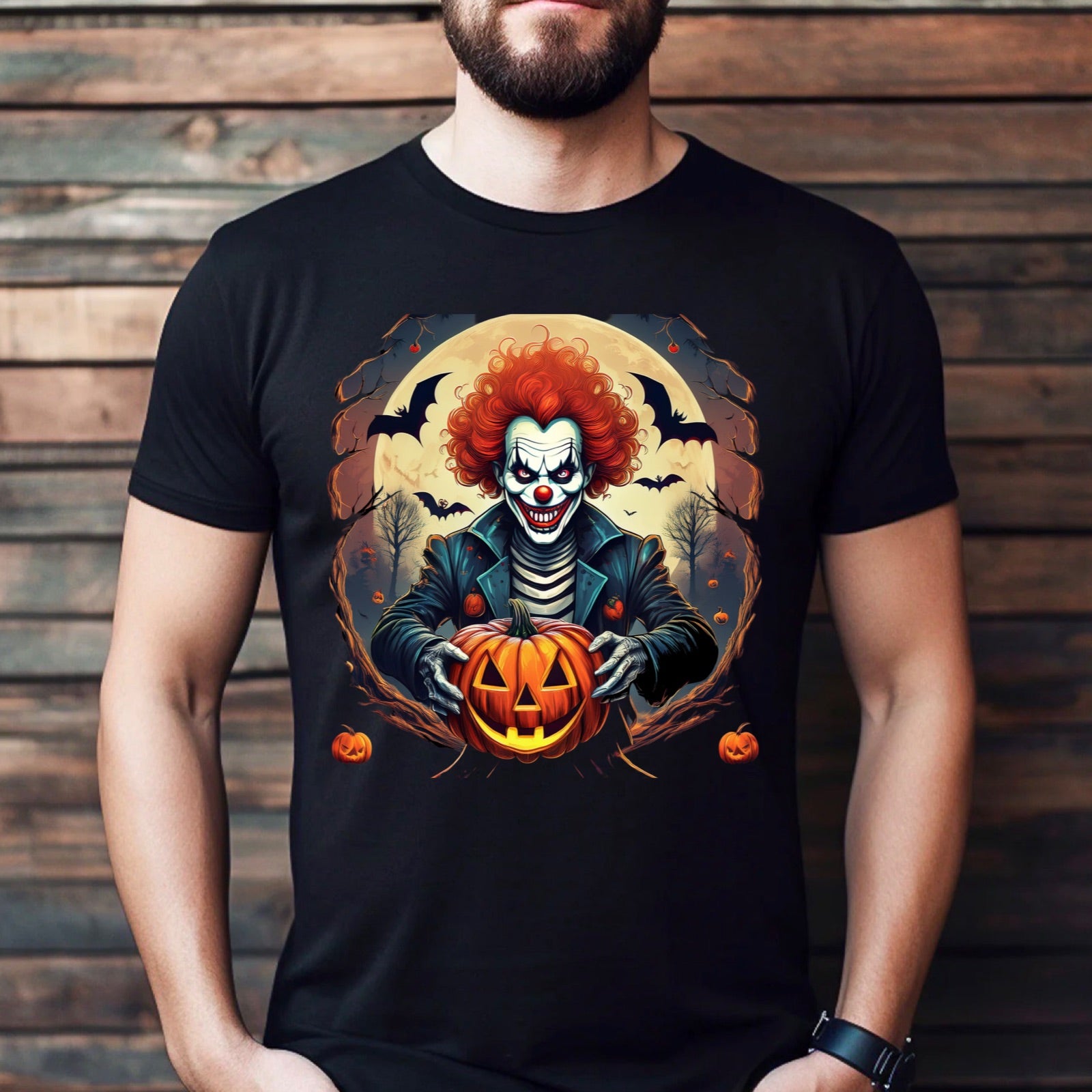 Men’s black t-shirt featuring a scary Halloween clown with a pumpkin and bats in a spooky full moon night design.