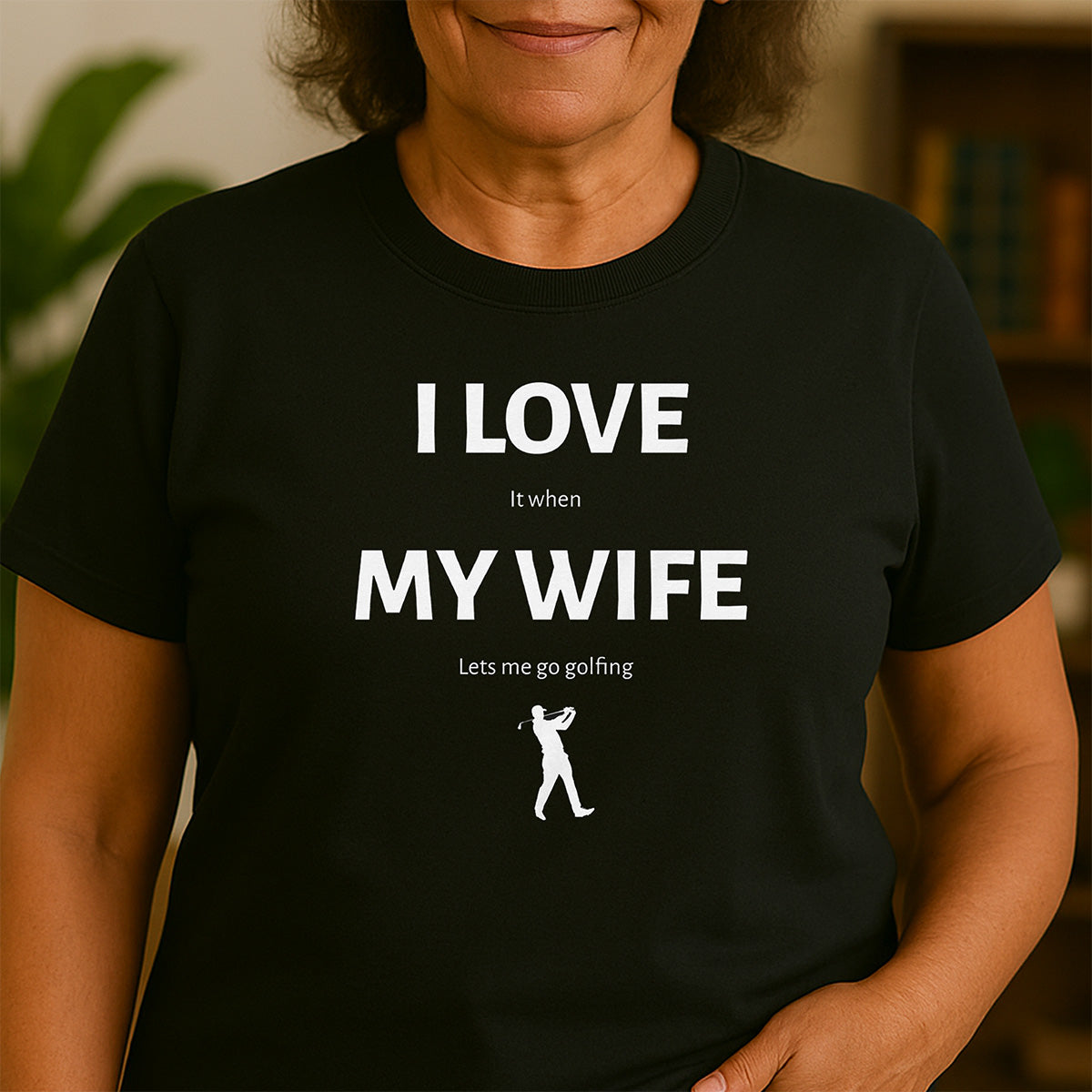 Women’s black crewneck t-shirt reading I LOVE MY WIFE lets me go golfing with golfer silhouette, funny golf gift