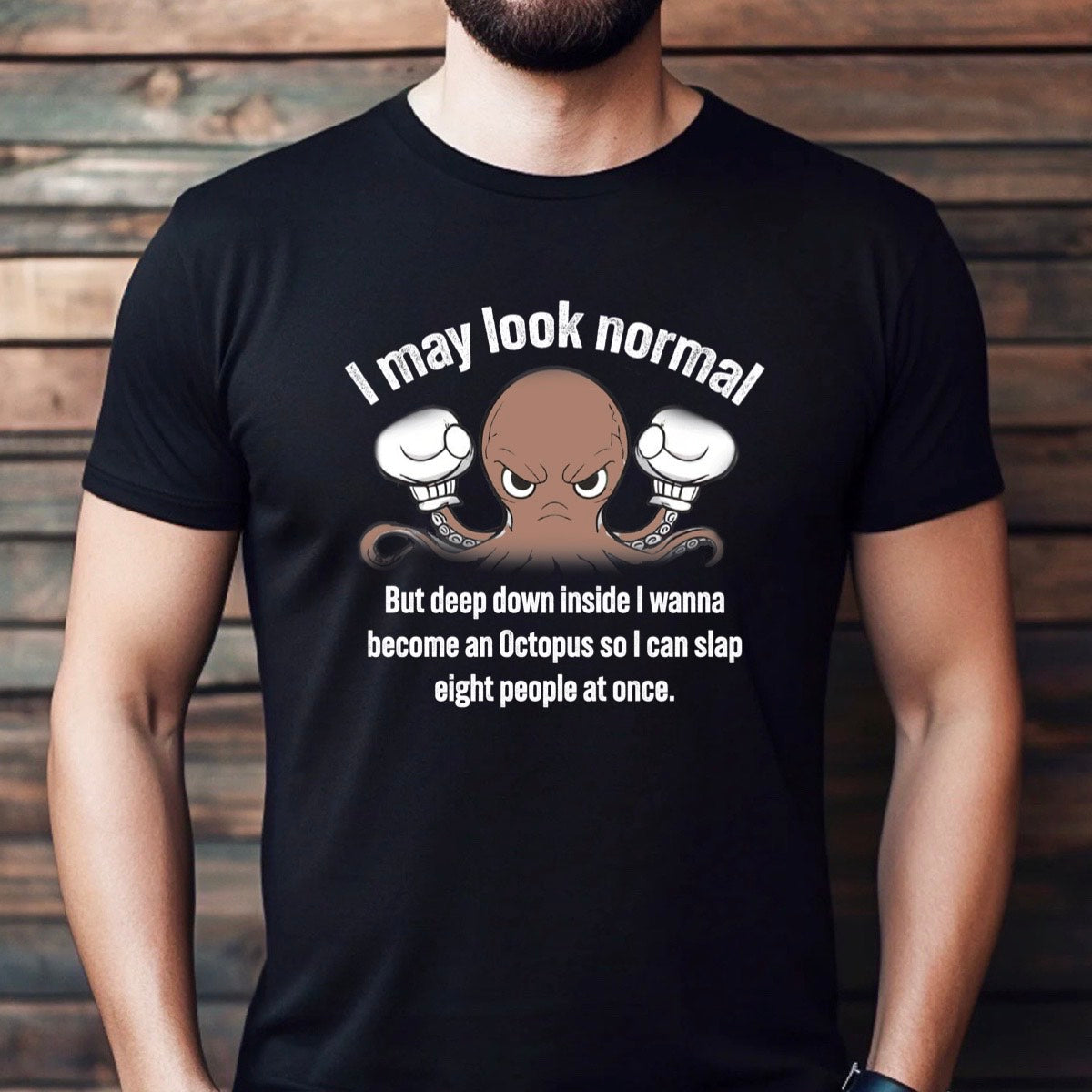 Man wearing black t-shirt with angry octopus cartoon and I may look normal funny quote, casual lifestyle