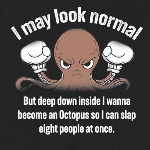 Closeup of angry octopus cartoon with boxing gloves and I may look normal quote on black tee, graphic detail