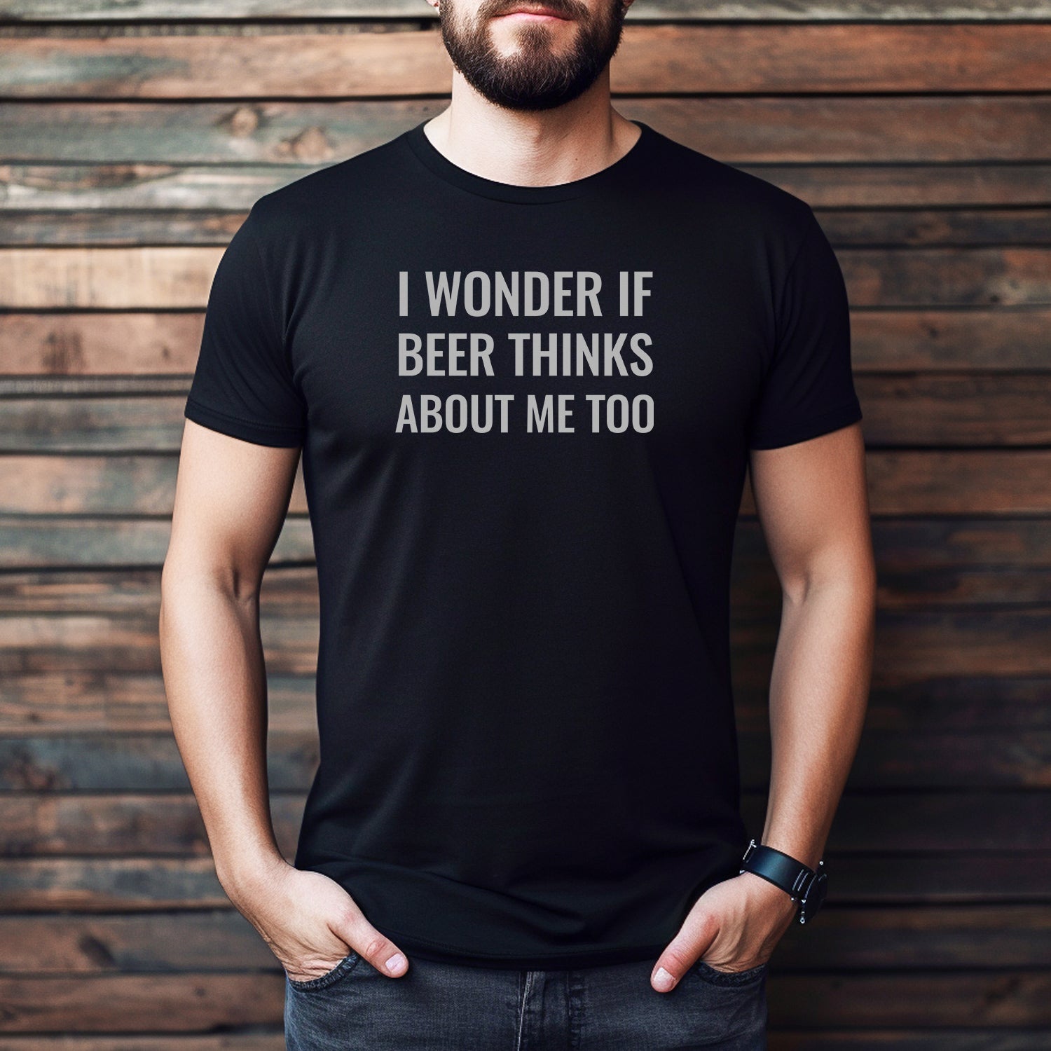 Man wearing black t-shirt with funny saying I wonder if beer thinks about me too in white text
