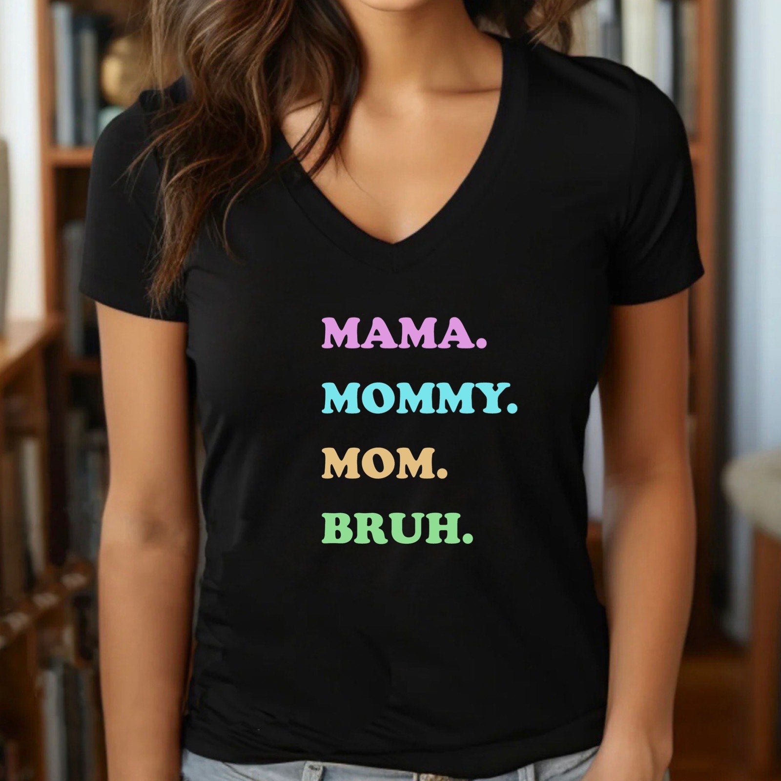 Woman wearing v-neck black t-shirt with pastel Mama Mommy Mom Bruh text, Mother’s Day gift tee