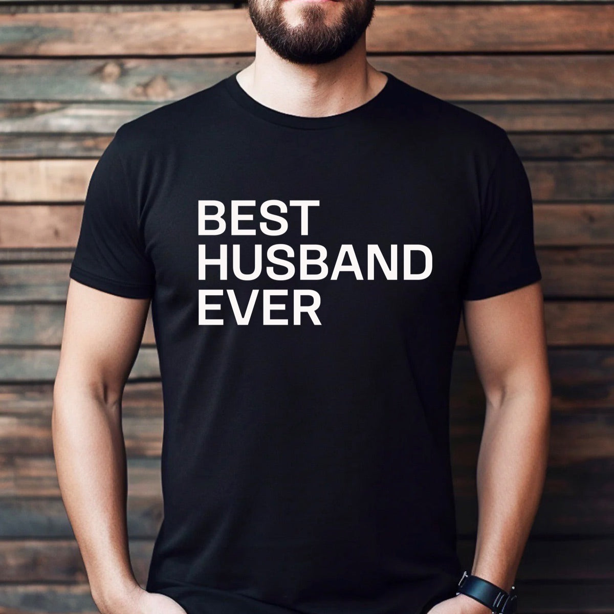 Man wearing fitted black crewneck t-shirt with bold white Best Husband Ever lettering