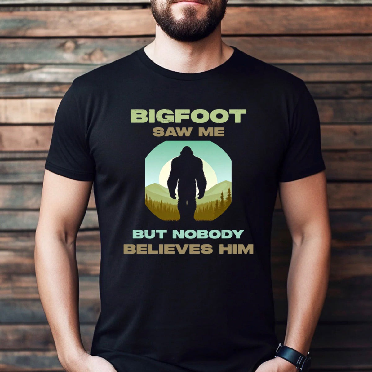 Man wearing funny Bigfoot saw me but nobody believes him t-shirt in black with retro style outdoors graphic