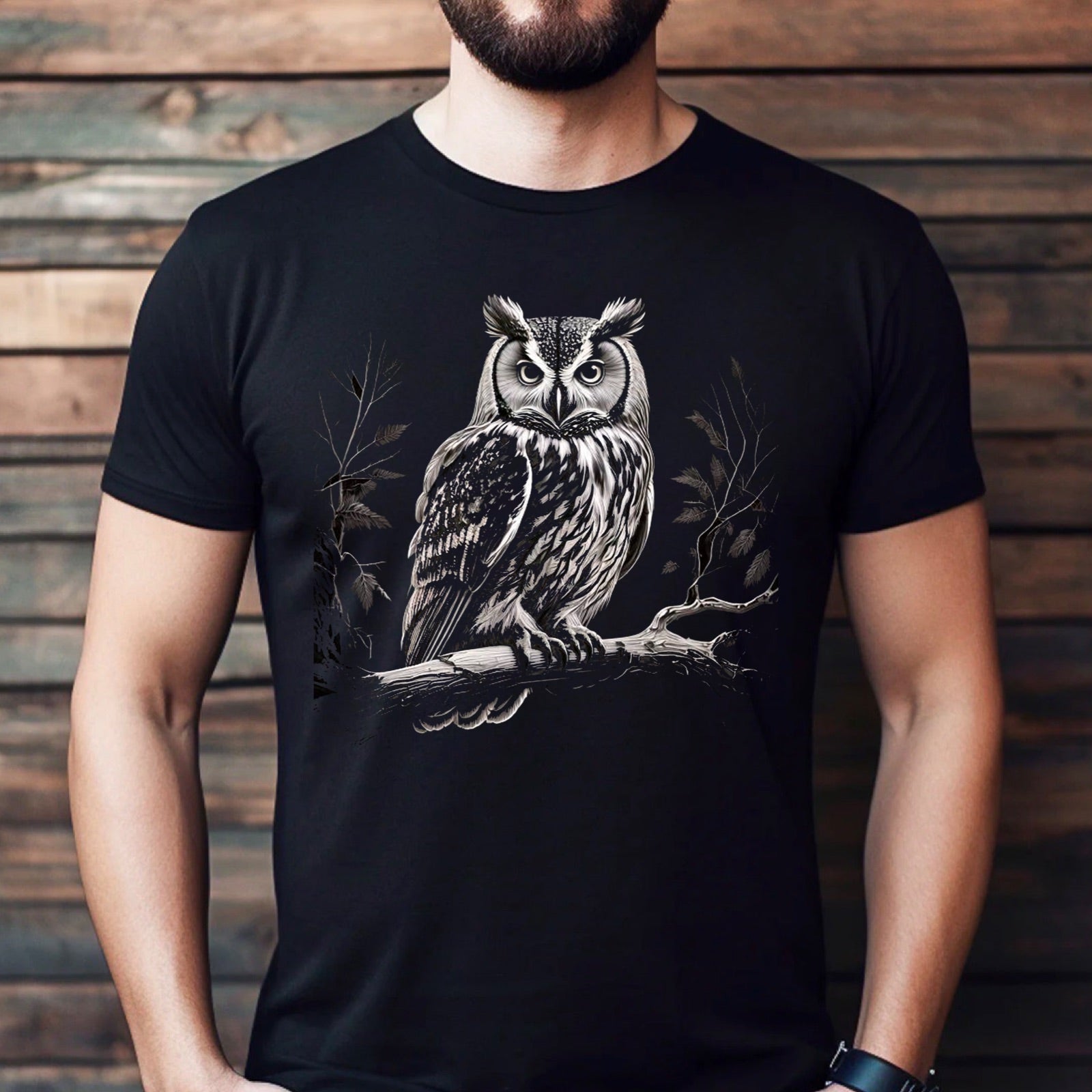 Men’s black owl on branch woodland t-shirt mockup against wooden wall background
