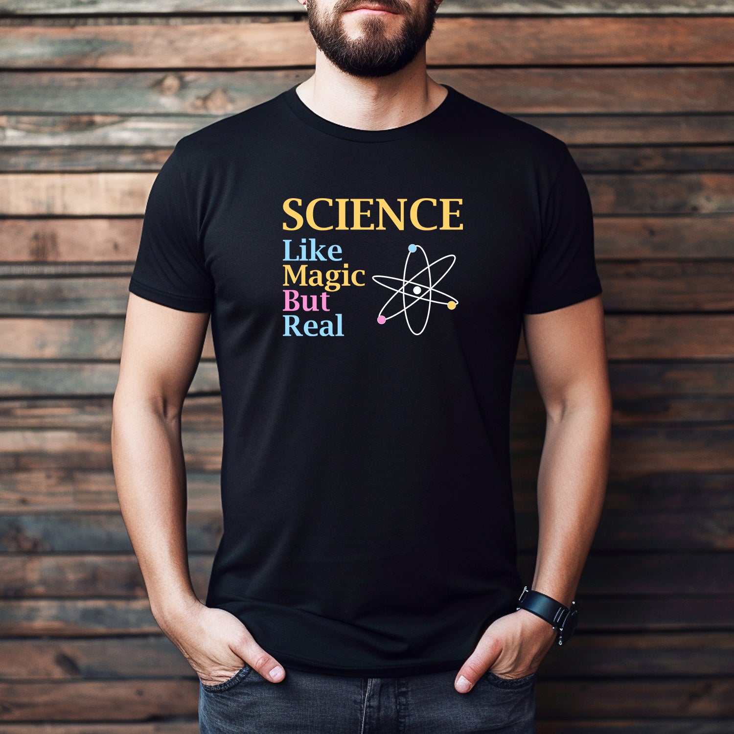 Man wearing black Science Like Magic But Real atom T-shirt, casual fit, nerdy science gift