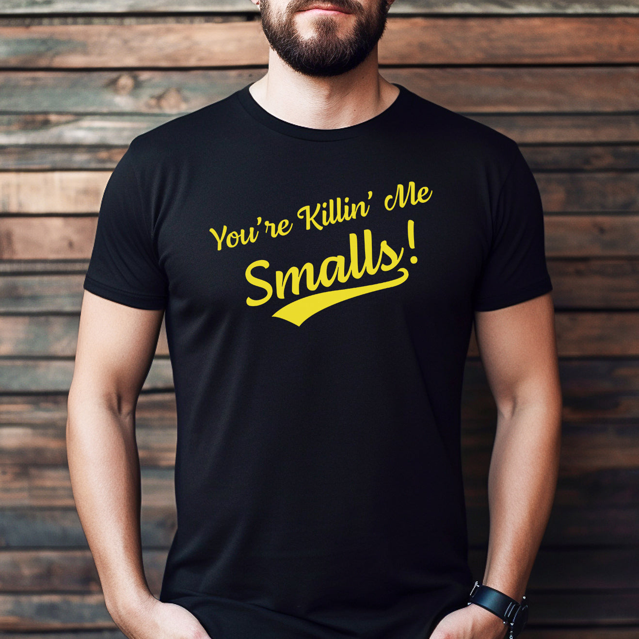 Man wearing black crew neck t-shirt with yellow You're Killin' Me Smalls funny graphic design