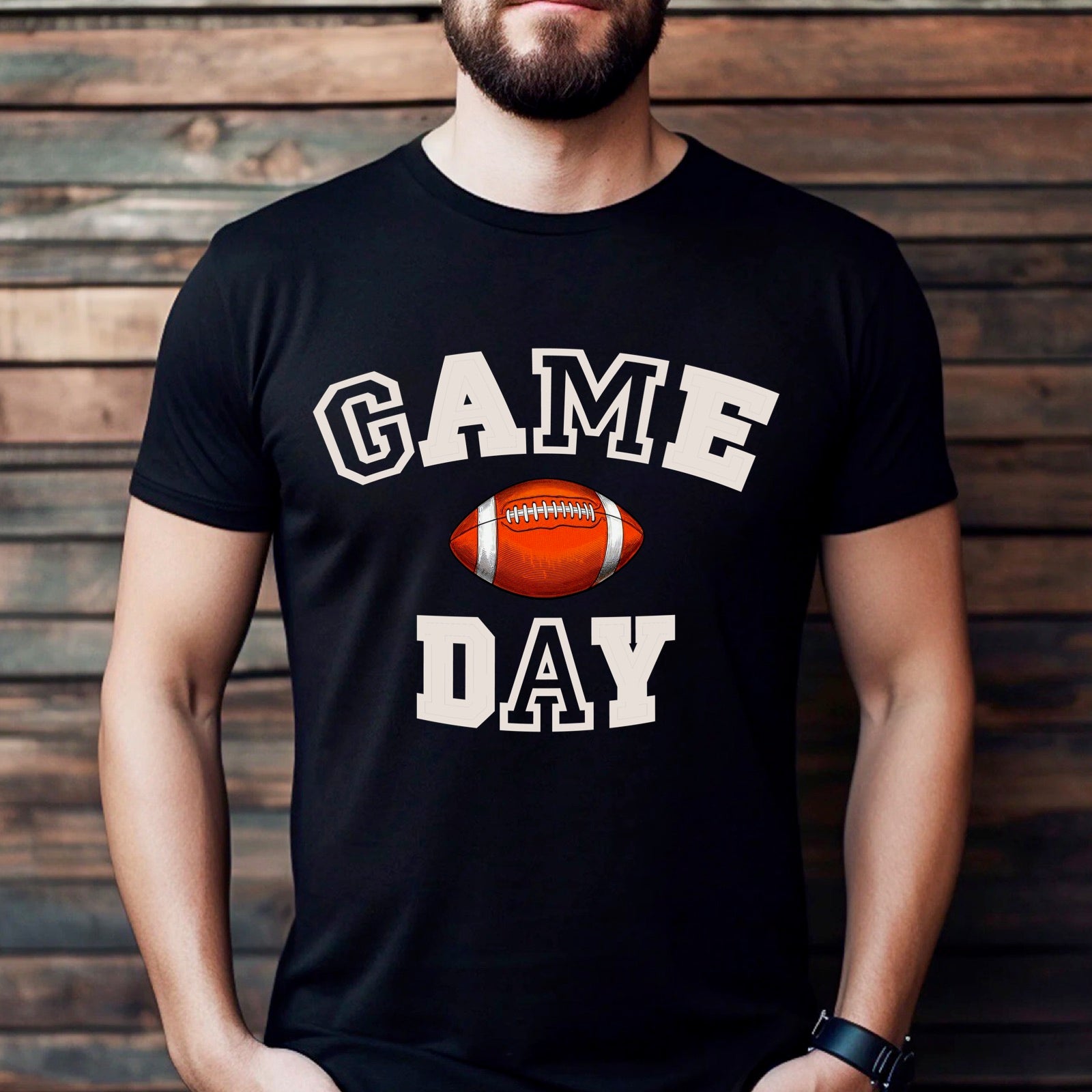 Man wearing black t-shirt with Game Day text and football graphic