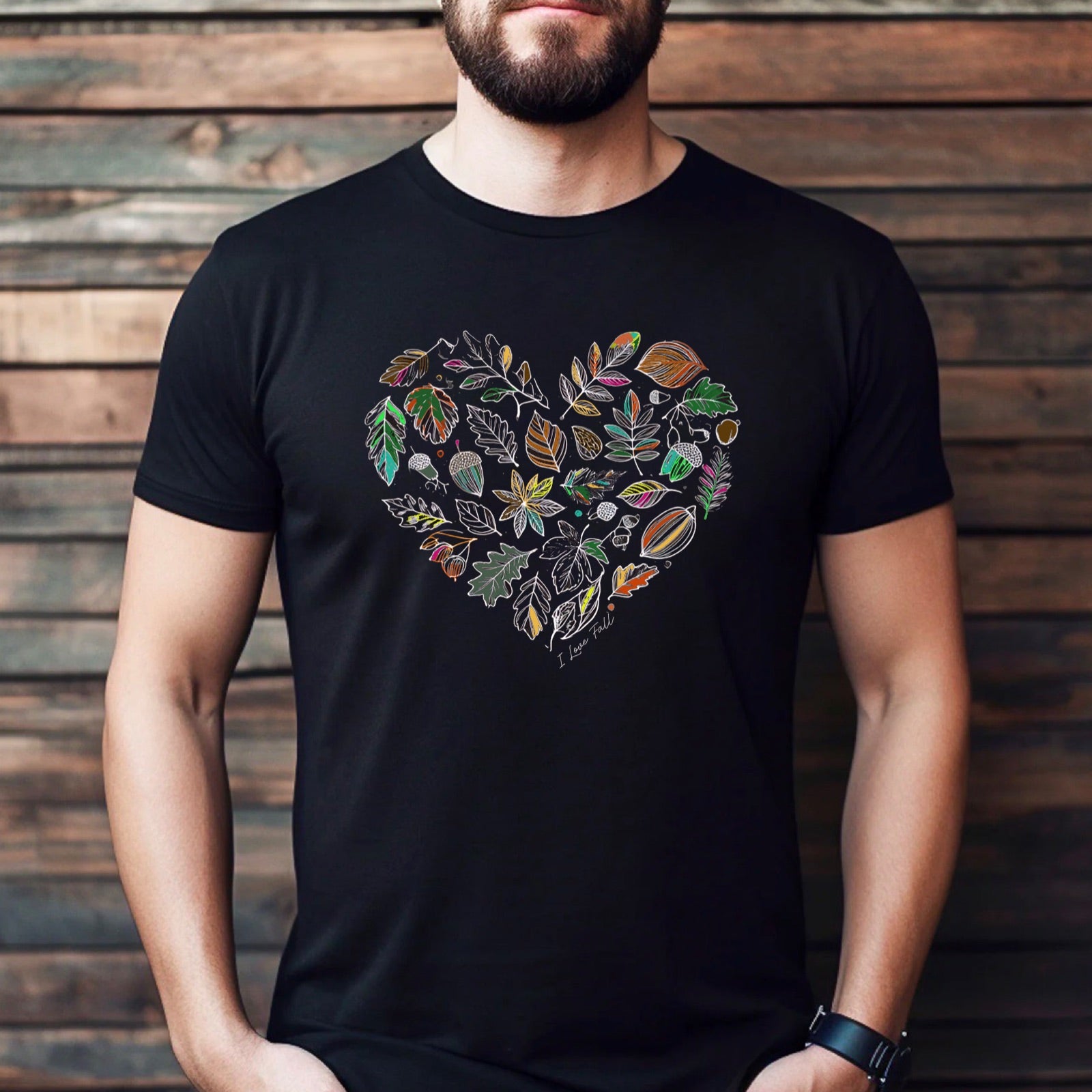 Man wearing black t-shirt with colorful heart-shaped fall leaf design