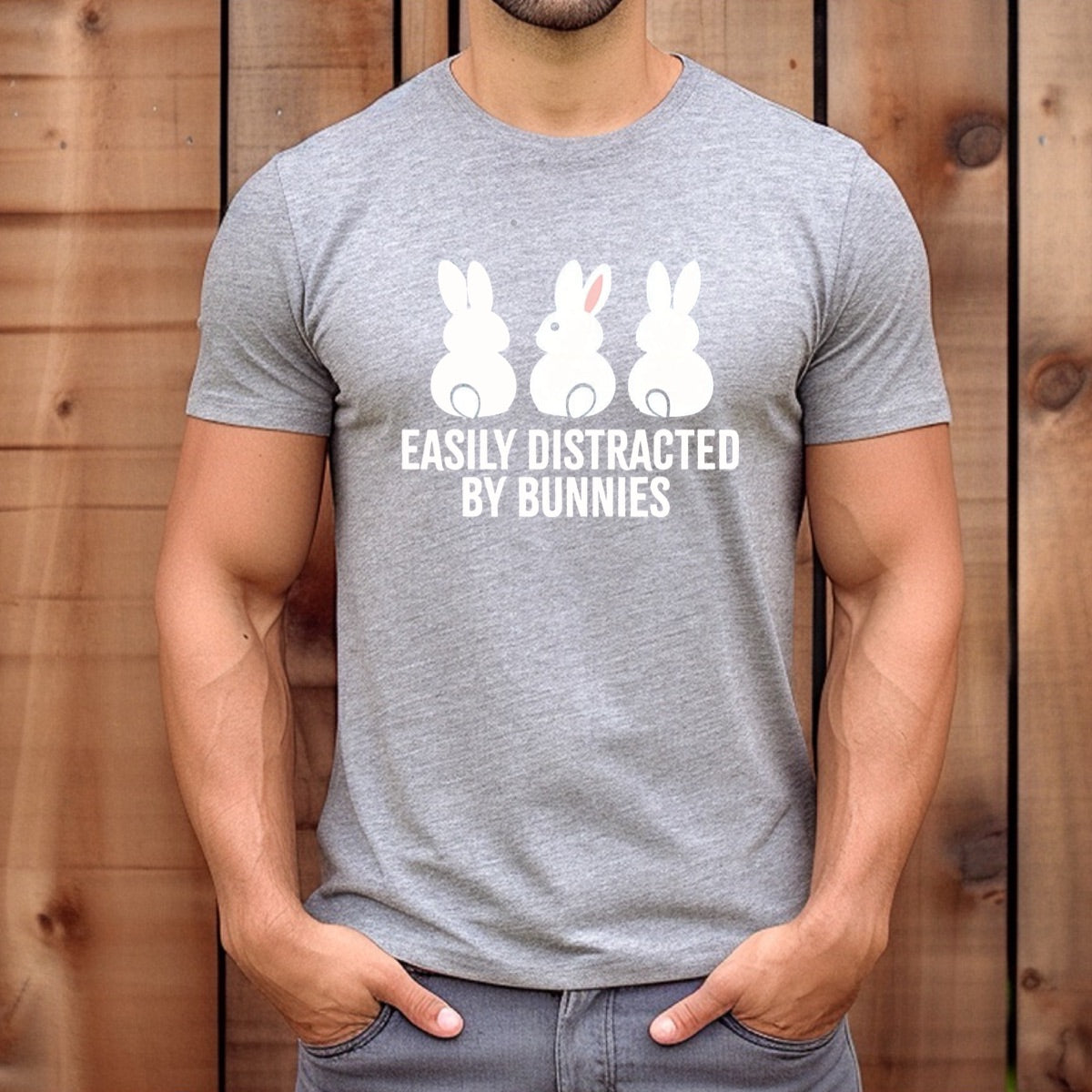 Man wearing gray t-shirt with three bunny design and funny text easily distracted by bunnies