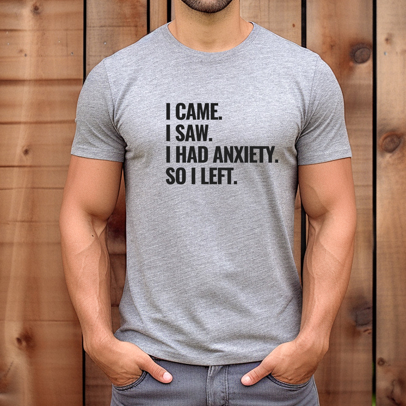 Man wearing grey anxiety quote t-shirt with bold black text I Came I Saw I Had Anxiety So I Left paired with jeans.
