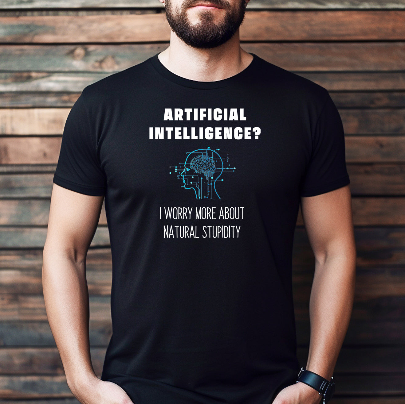 Man wearing a black funny AI quote t-shirt that reads "Artificial Intelligence? I worry more about natural stupidity."