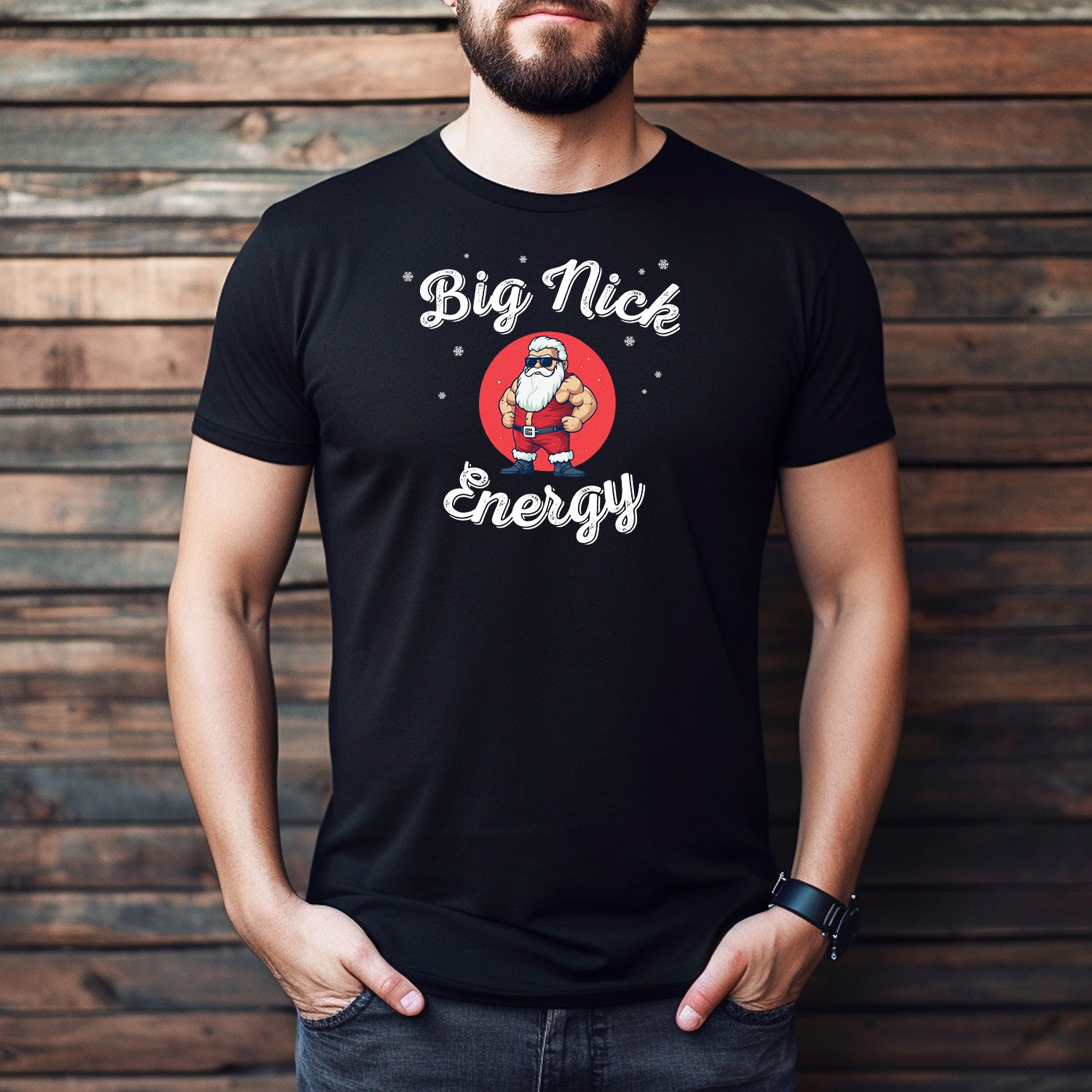 Man wearing Big Nick Energy Santa t-shirt with strong Santa cartoon in red circle design