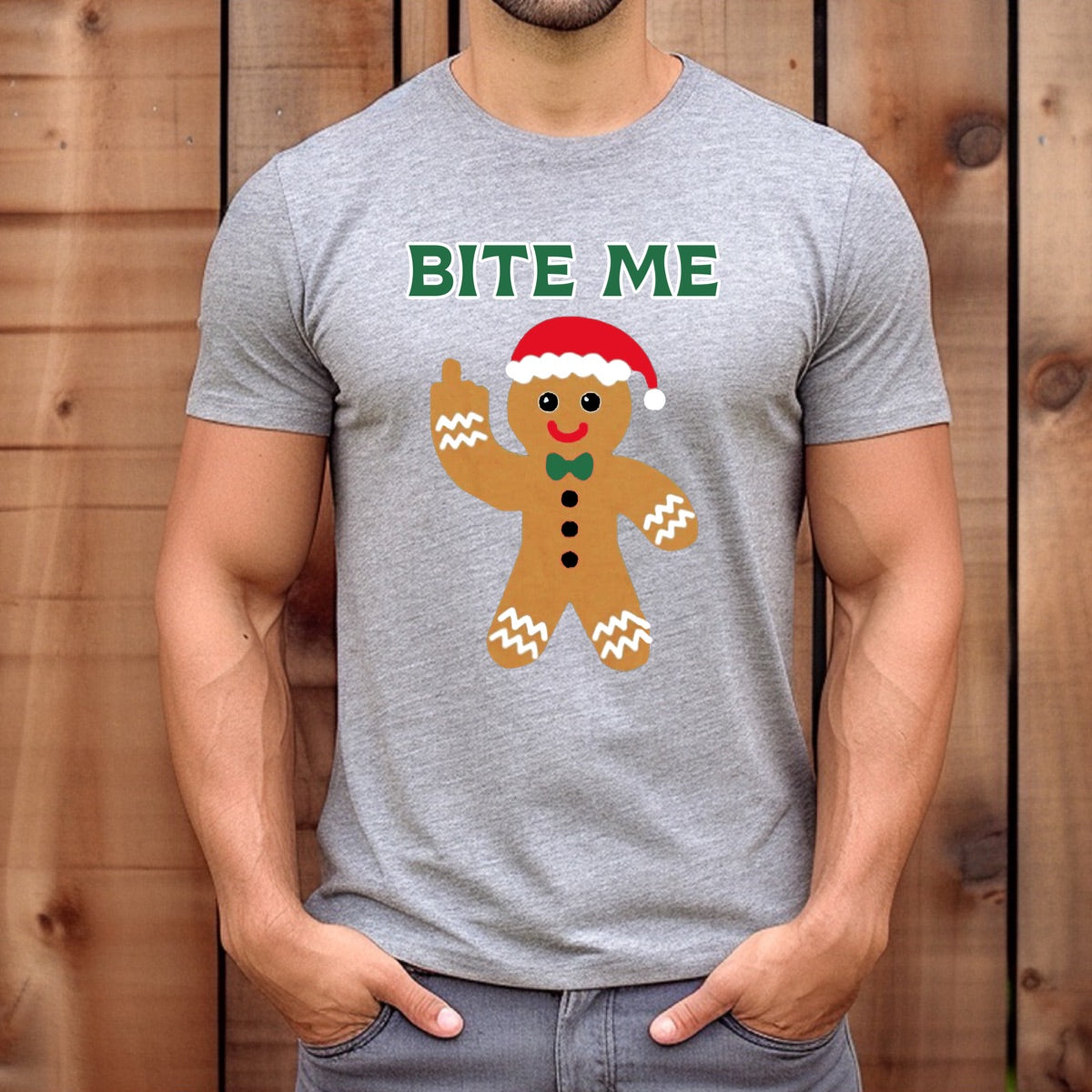 Man wearing grey Bite Me gingerbread Christmas t-shirt with Santa hat design