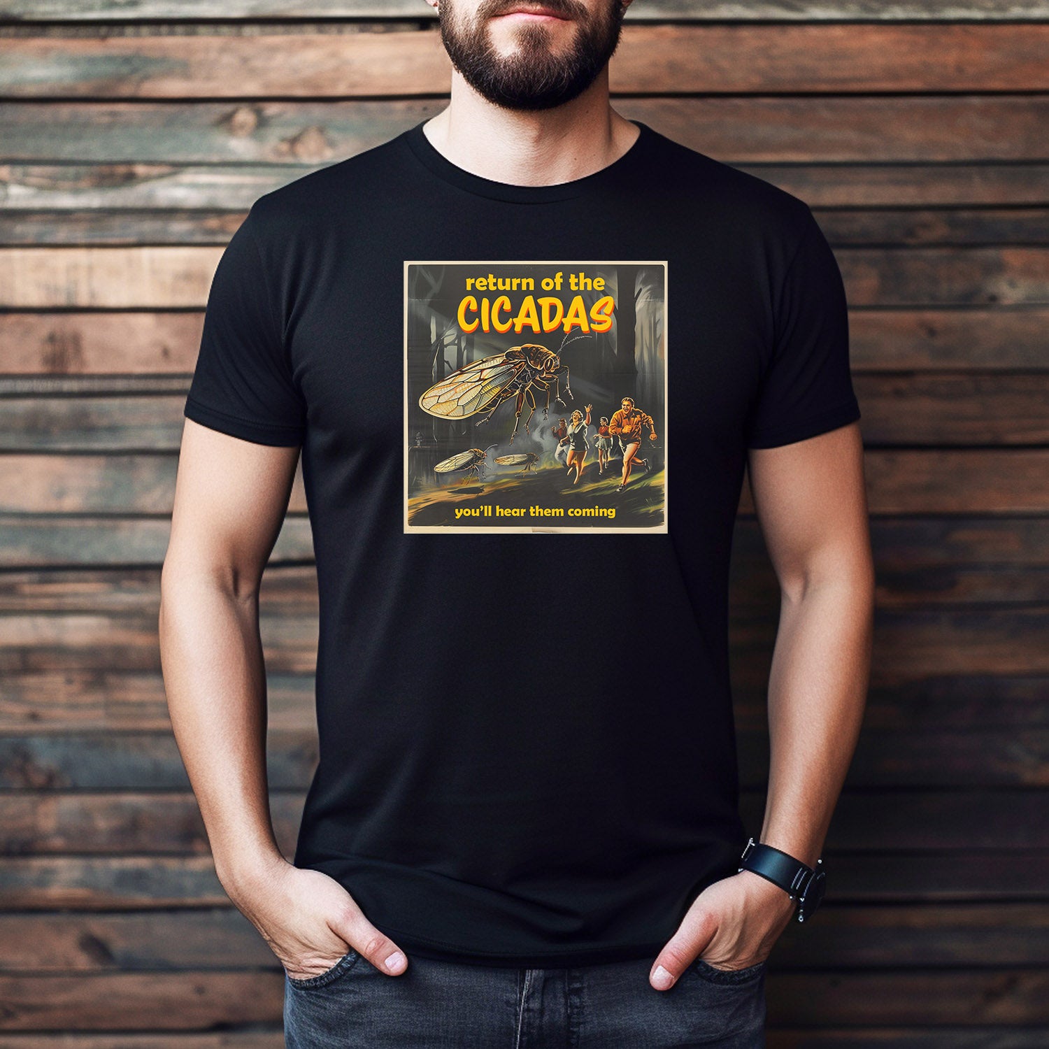 Man wearing black T-shirt with giant cicada horror design and “Return of the Cicadas” text.
