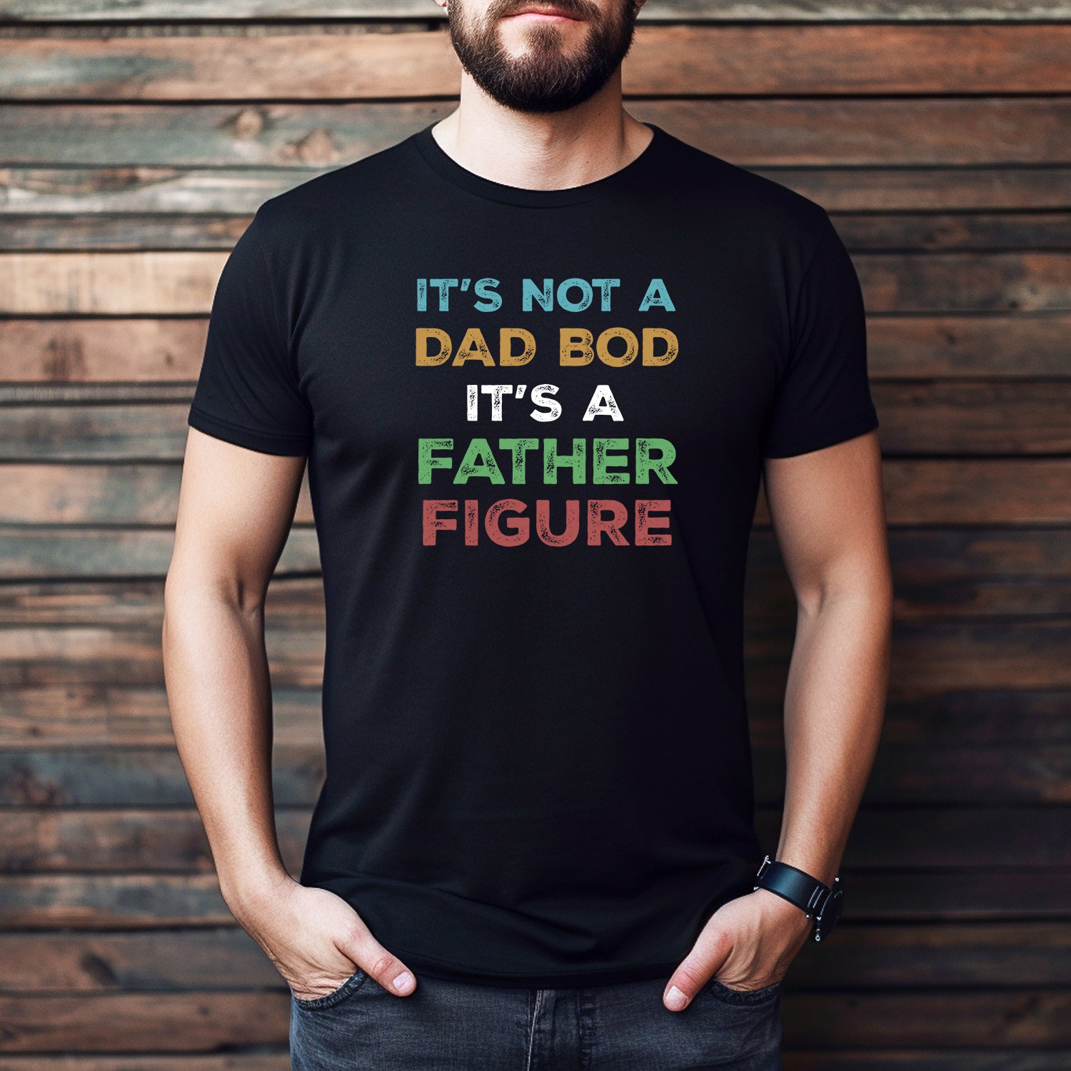 Man wearing a black t-shirt with funny slogan "It’s Not a Dad Bod, It’s a Father Figure" – perfect gift for dads.